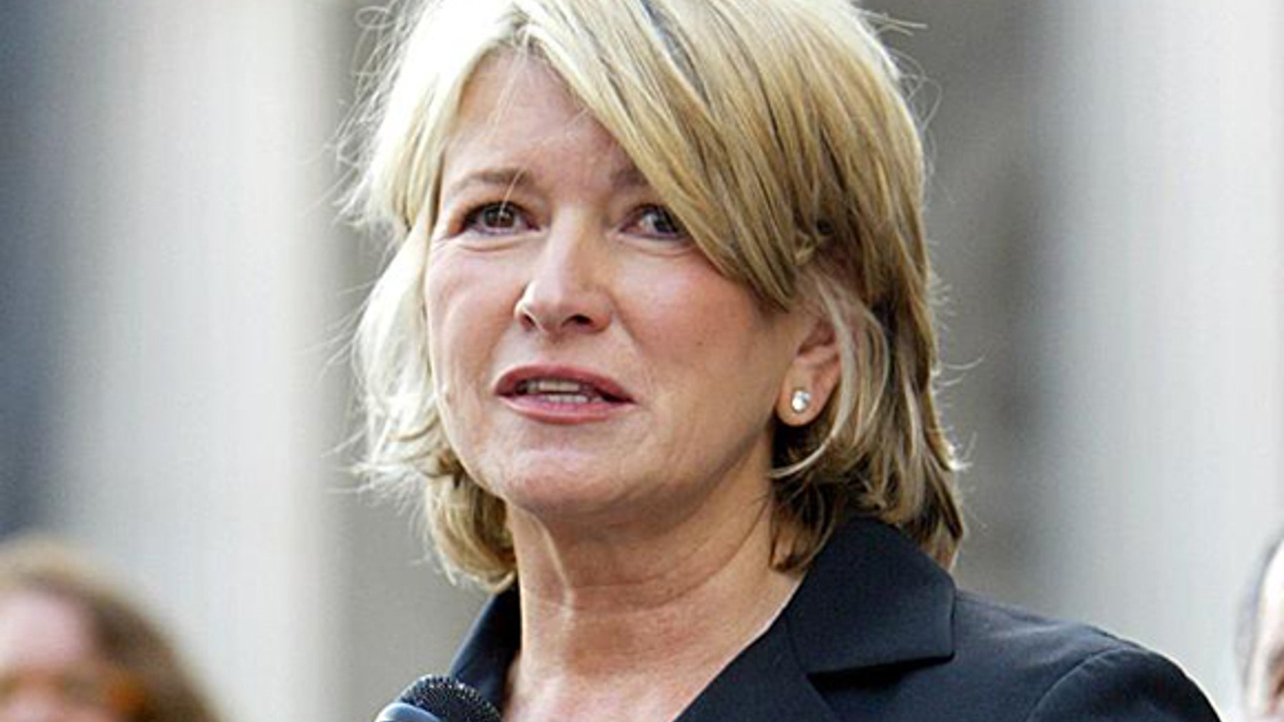 Martha Stewart reads a statement after sentencing at Manhattan federal court, Friday July 16, 2004, in New York.