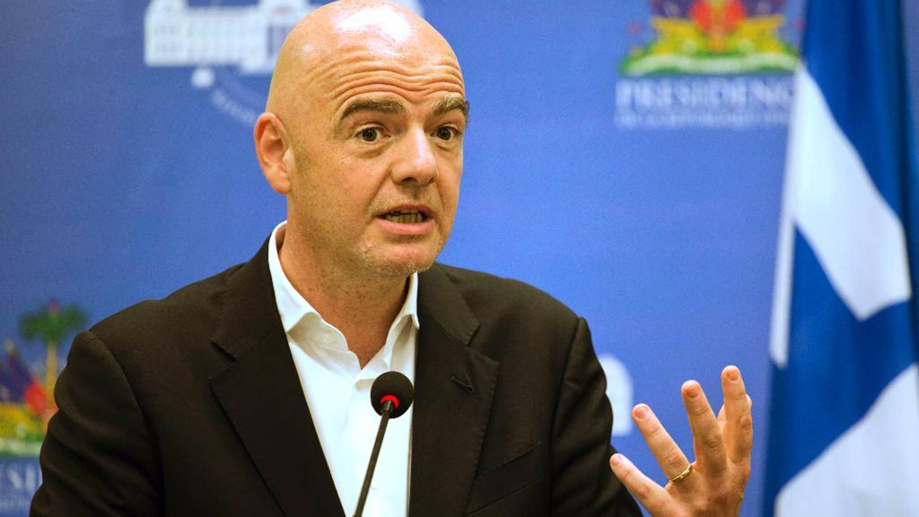 FILE - In this Saturday, April 29, 2017 file photo, FIFA President Gianni Infantino gives a press conference at the National Palace in Port-au-Prince, Haiti. An accelerated process to hand North America the 2026 World Cup is set to be approved by soccer leaders this week, with FIFA President Gianni Infantino hoping for a "bulletproof" process to avoid past voting scandals. The United States, Canada, and Mexico are seeking an unchallenged path to co-hosting rights for the 2026 showpiece, if FIFA's technical requirements are met by next year "It's an interesting, original proposal and we will discuss it tomorrow at the council and present the recommendation to the congress," Infantino told The Associated Press on Monday, May 8, 2017 .(AP Photo/Dieu Nalio Chery, file)