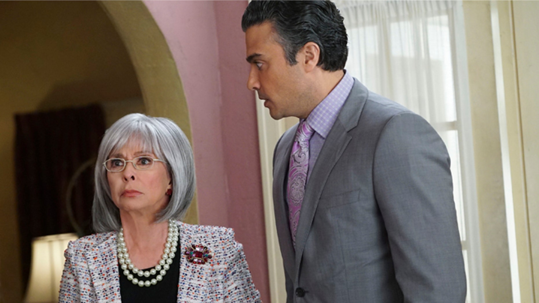 This photo provided by The CW shows, Rita Moreno, left, as Liliana, and Jaime Camil as Rogelio, in the episode Chapter Eighteen, of the television series, "Jane the Virgin. Moreno guest stars on the Monday April 13, 2015 episode playing a difficult grandmother. (AP Photo/The CW, Danny Feld) MANDATORY CREDIT: NO SALES; NO ARCHIVES; NORTH AMERICA USE ONLY.
