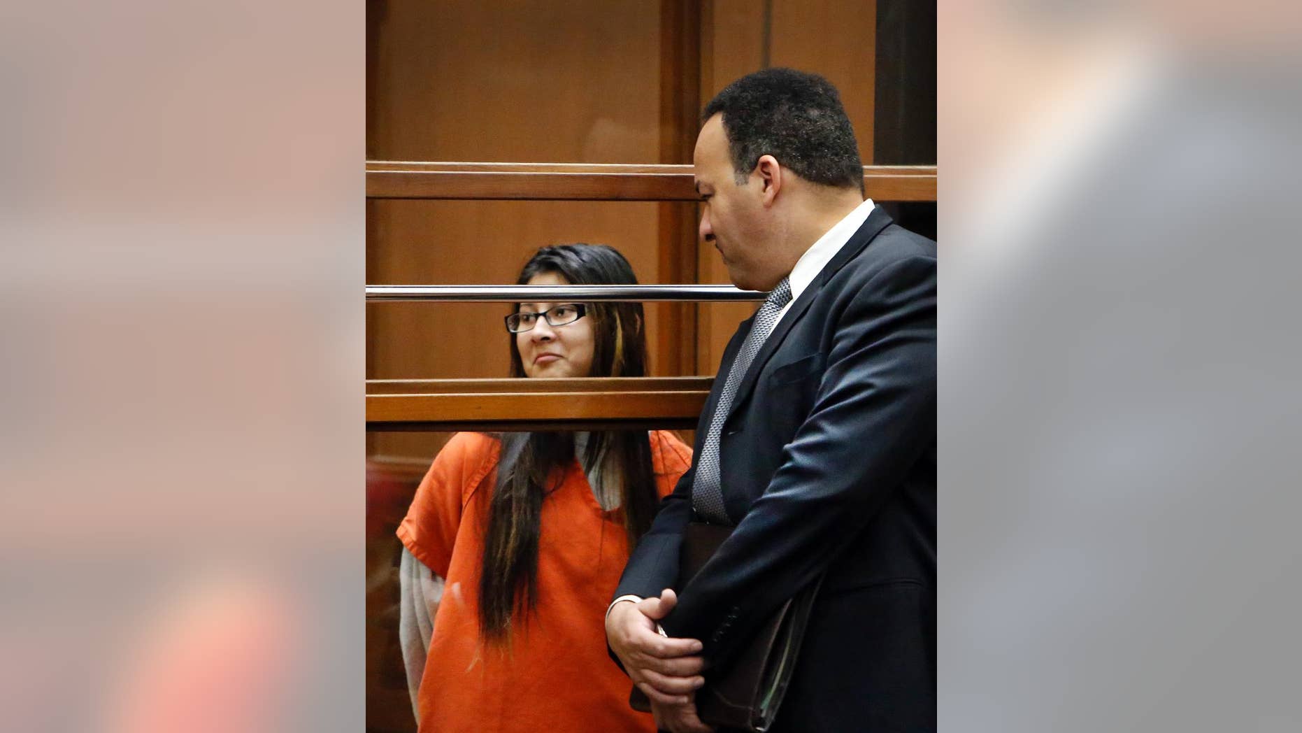 FILE - In this Jan. 12, 2015, file photo, Alejandra Guerrero, left, appears in Los Angeles Superior Court with her attorney Errol Cook, right. Guerrero was found guilty of first-degree murder and other charges Thursday, Oct. 13, 2016, in the beating death of a Chinese graduate student at the University of Southern California as he walked home after a late-night study session. Guerrero was the first of four people to be tried in the slaying of 24-year-old Xinran Ji during a robbery attempt in 2014. (Al Seib /Los Angeles Times via AP, Pool, File
