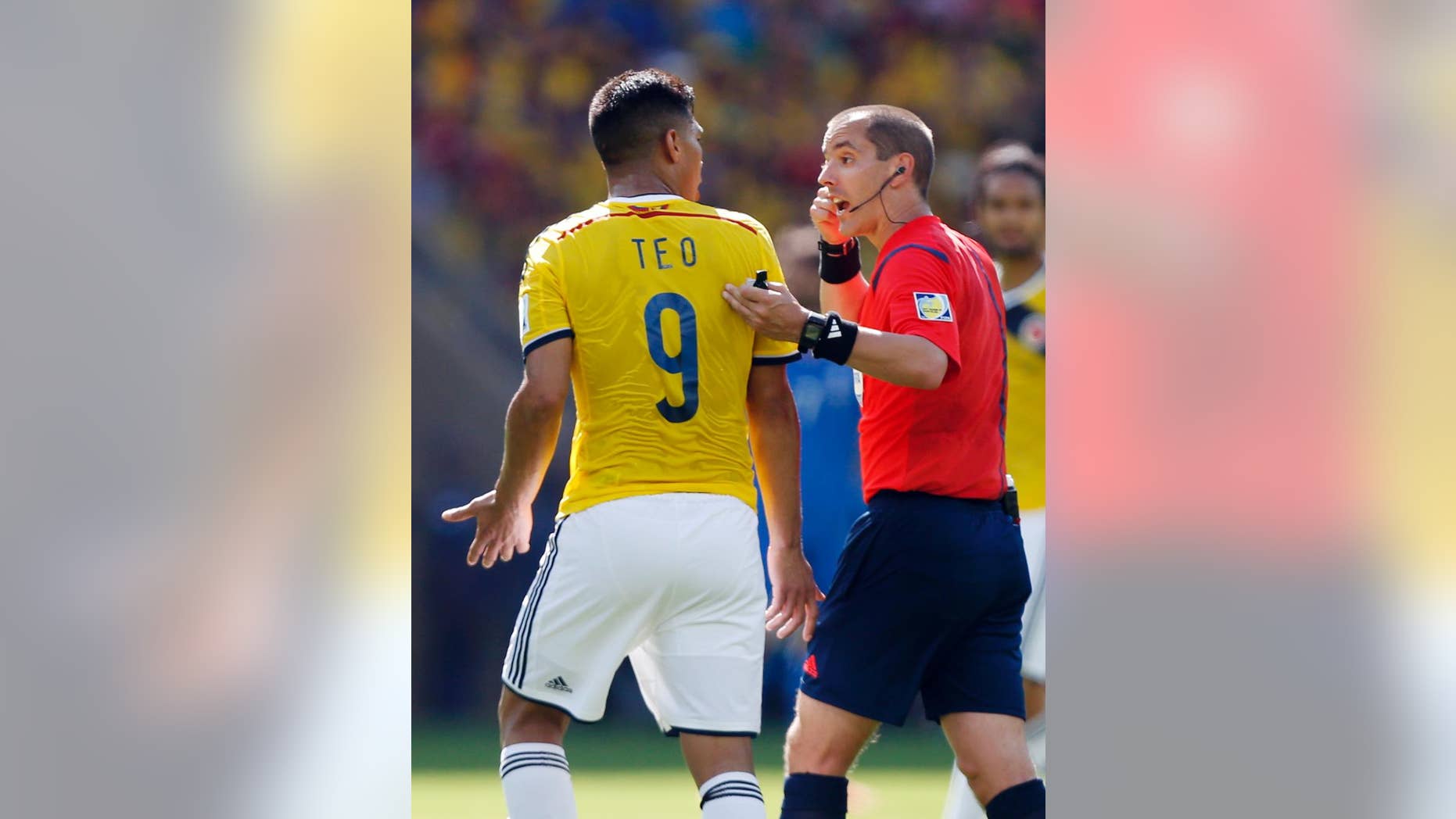 Referee Mark Geiger from the United States talks to Colombia's Teofilo Gutierrez during the group C World Cup soccer match between Colombia and Greece at the Mineirao Stadium in Belo Horizonte, Brazil, Saturday, June 14, 2014. (AP Photo/Jon Super)