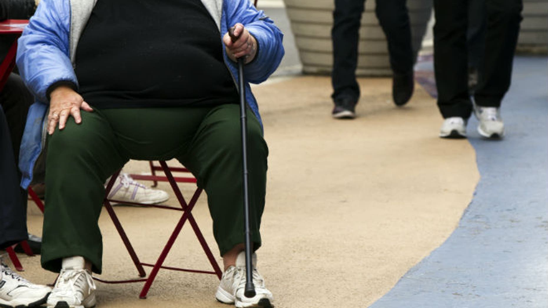 An overweight woman sits on a chair in Times Square in New York. (REUTERS/Lucas Jackson)