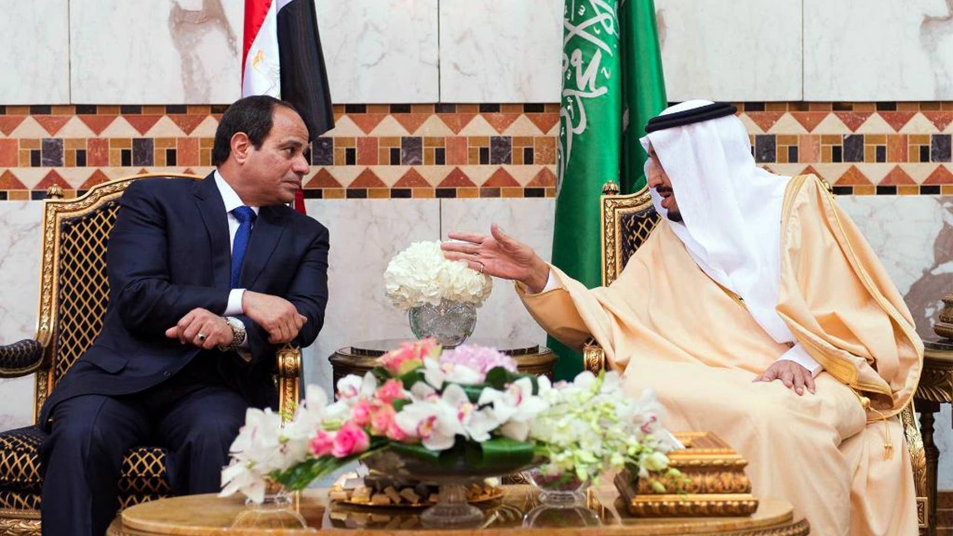 FILE - In this file photo provided by the Saudi Press Agency on March 1, 2015, Saudi King Salman, right, meets with Egyptian President Abdel-Fattah el-Sissi upon his arrival to Riyadh Airbase, Riyadh, Saudi Arabia. Egypt's president says his country remains committed to close relations with its Gulf Arab allies, but will continue to independently pursue its own policies to safeguard Arab security. El-Sissi's comments on Thursday, Oct. 13, 2016 were his first after a diplomatic row erupted this week between Egypt and close ally Saudi Arabia over Syria.(SPA via AP, File)