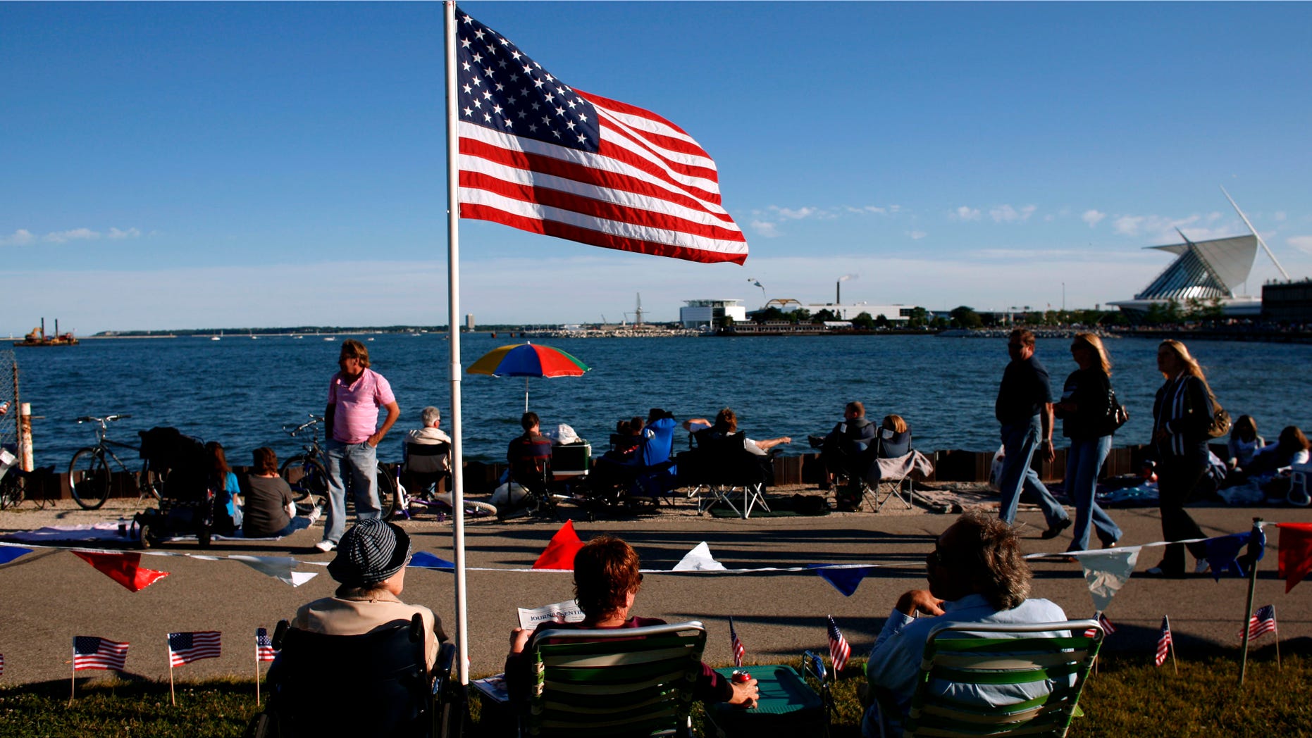MILWAUKEE - JULY 3: People gather in downtown Milwaukee along the lake front of Lake Michigan, as the city celebrates Independence day with fireworks on July 3, 2008 Milwaukee. The city traditionally has the fireworks on the 3rd as so it does not compete with the local surrounding communities 4th of July celebrations. (Photo by Darren Hauck/Getty Images)