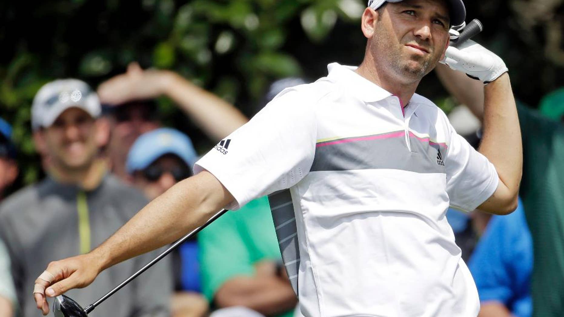 Sergio Garcia, of Spain, watches his tee shot on the ninth hole during the second round of the Masters golf tournament Friday, April 11, 2014, in Augusta, Ga. (AP Photo/Darron Cummings)