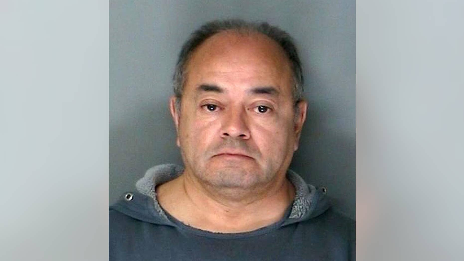 FILE - This undated file photo provided by the Suffolk County District Attorney's office in Riverhead, N.Y., shows foster parent Cesar Gonzales-Mugaburu. An attorney for the foster parent accused of sexually abusing his foster sons over two decades said Friday, April 21, 2017, that no forensic, medical or physical evidence suggests his client committed the abuse.(Suffolk County District Attorney's Office via AP, File)