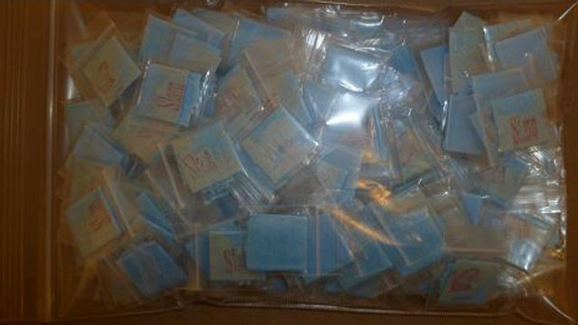 October 6, 2014: Packets of heroin taken from a daycare center in Selbyville, Del. are displayed. A 30-year-old woman was arrested and charged after authorities say her daughter inadvertently brought the packets to the center and began handing them out to classmates. (Delaware State Police)