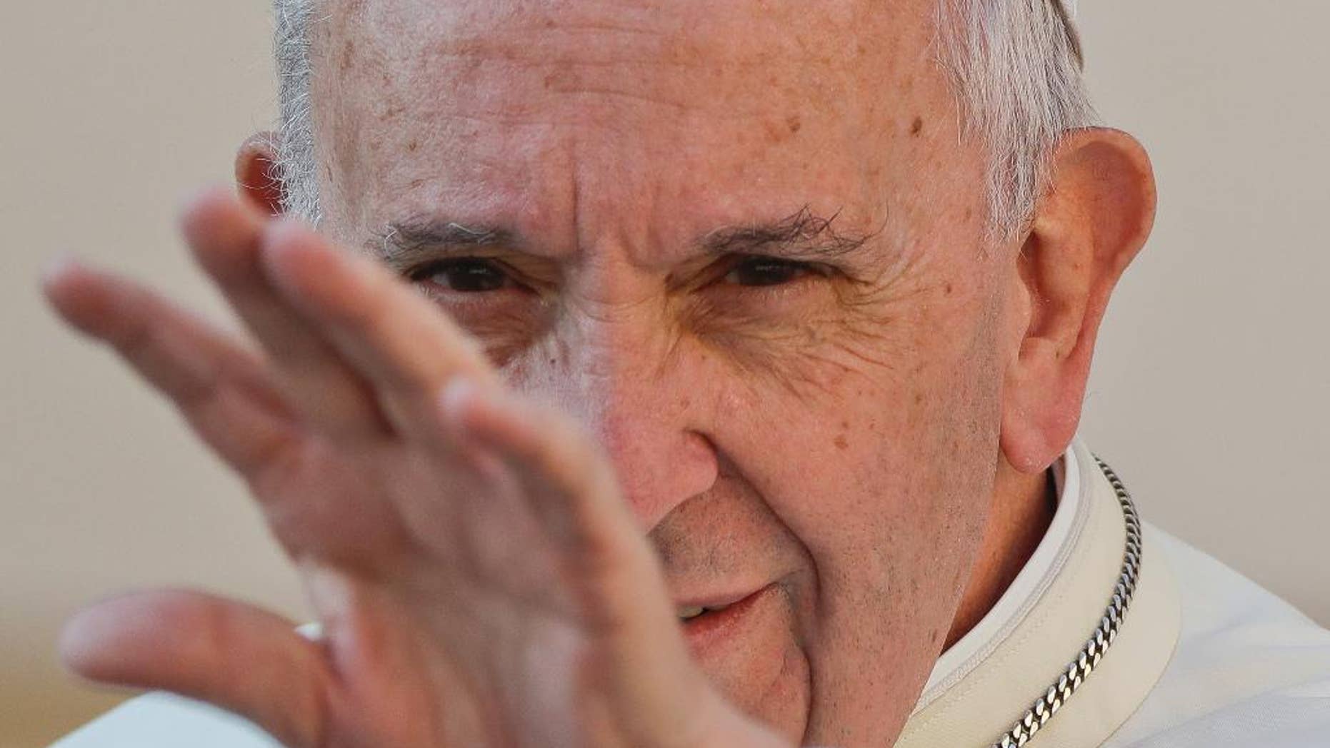 Pope Francis waves to the faithful as he arrives for his weekly general audience, in St. Peter's Square, at the Vatican, Wednesday, Sept. 28, 2016. (AP Photo/Andrew Medichini)