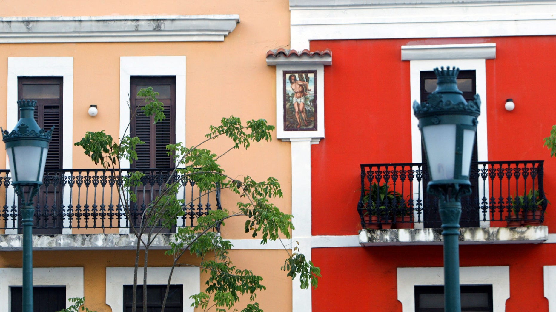 SAN JUAN, PUERTO RICO- APRIL 26: Colorful homes line the cobblestoned streets April 26, 2004 in Old San Juan, the original capital city of San Juan, Puerto Rico. The old city is a historic district of seven square blocks made up of ancient buildings and colonial homes, massive stone walls and vast fortifications, sunny parks and cobblestoned streets. (Photo by Joe Raedle/Getty Images)