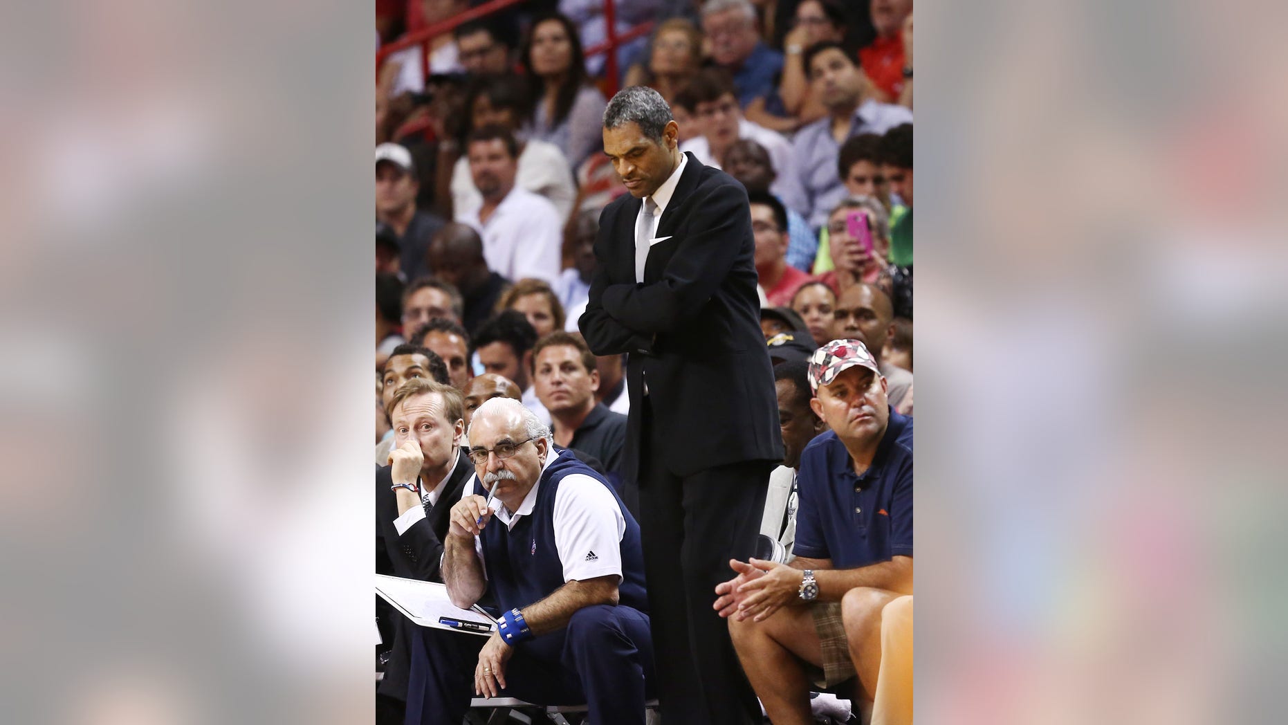 Detroit Pistons head coach Maurice Cheeks watches game action against the Miami Heat during the second half of an NBA basketball game in Miami, Monday, Feb. 3, 2014. The Heat won 102-96. (AP Photo/J Pat Carter)