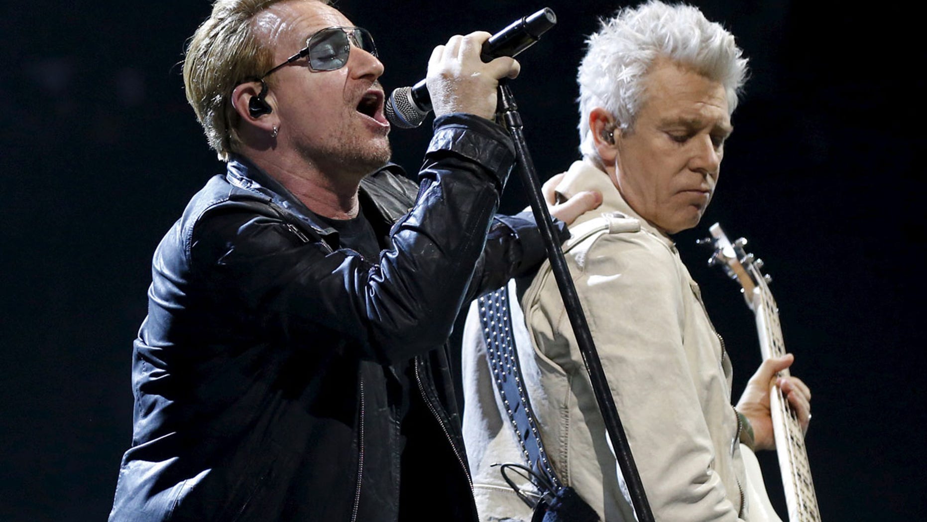 FILE 2015: Bono and Adam Clayton of Irish band U2 perform during their concert at the AccorHotels Arena in Paris.