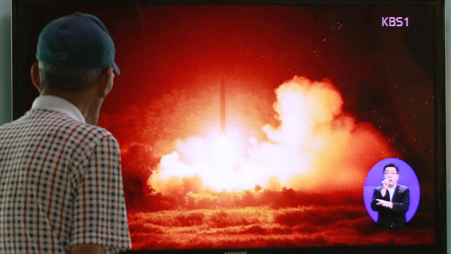 A man watches a TV news program showing a file picture of a missile launch conducted by North Korea, at Seoul Railway Station in Seoul, South Korea, Sunday, July 13, 2014. North Korea launched ballistic missiles into the sea on Sunday, South Korea said, the latest in a series of test-firings seen as expressions of anger over the North’s failure to win talks on receiving outside aid, and over ongoing U.S.-South Korean military drills. (AP Photo/Ahn Young-joon)
