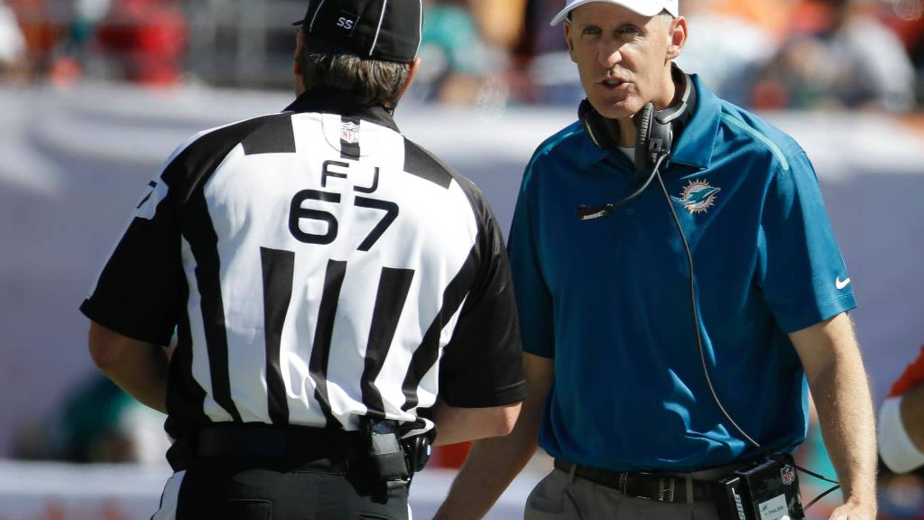 Miami Dolphins strong safety Will Davis (29) congratulates Miami Dolphins wide receiver Jarvis Landry (14) after officials reversed a call and granted Landry a touchdown during the second half of an NFL football game against the San Diego Chargers, Sunday, Nov. 2, 2014, in Miami Gardens, Fla. (AP Photo/Lynne Sladky)