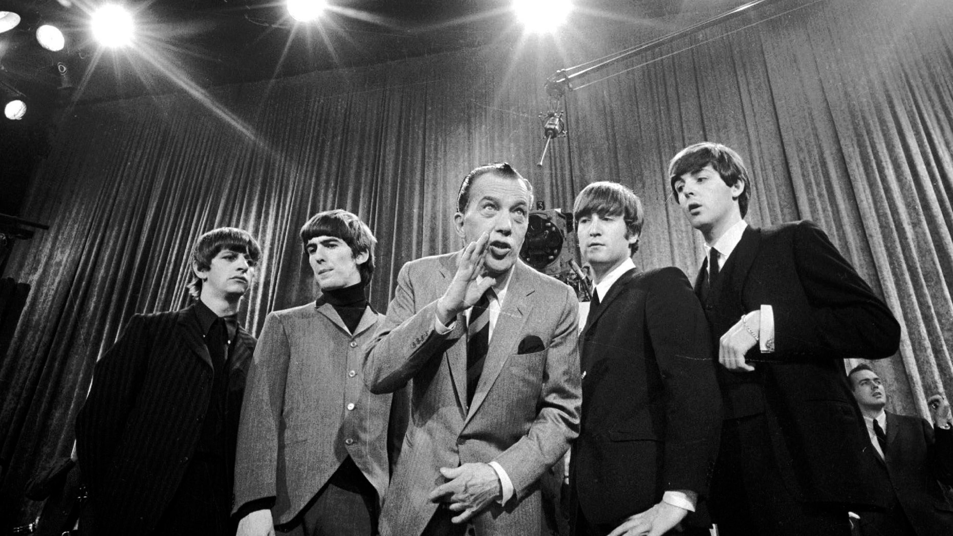 Feb 9, 1964. Ed Sullivan, center, stands with The Beatles, from left, Ringo Starr, George Harrison, John Lennon, and Paul McCartney, during a rehearsal for the British group's first American appearance, on the "Ed Sullivan Show," in New York. CBS is planning a two-hour special on Feb. 9, 2014, to mark the 50th anniversary of the Beatles' first appearance in America on "The Ed Sullivan Show."