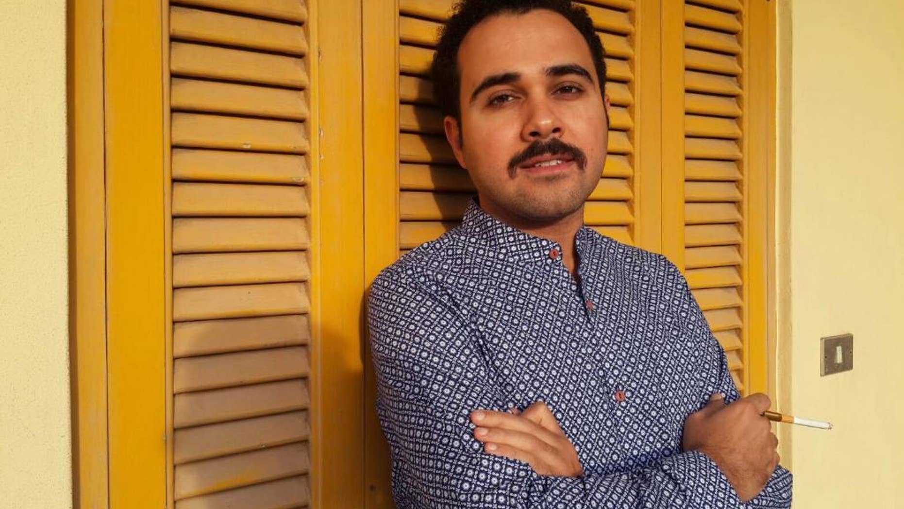 FILE - In this undated file image Egyptian author Ahmed Naji poses for a photo in Cairo, Egypt. Naji on Thursday, Dec. 22, 2016, has walked out of a Cairo police station, after a court suspended his two-year-sentence pending review of his appeal on obscenity charges. (Yasmin Hosam El Din via AP, File)