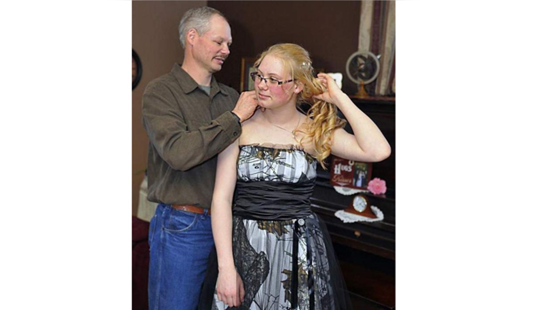 David Herron made a camouflage prom dress for his youngest daughter, Mariah, 17, in Marshfield, Wis.