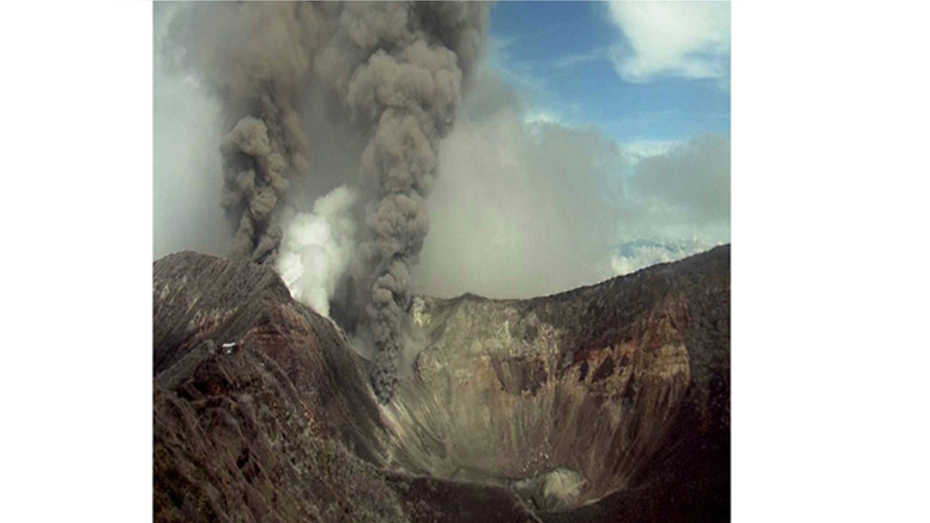 May 21, 2013: In this image provided by the Volcanological and Seismological Observatory of Costa Rica, the Turrialba volcano emits an ash-filled gas plume in Costa Rica.