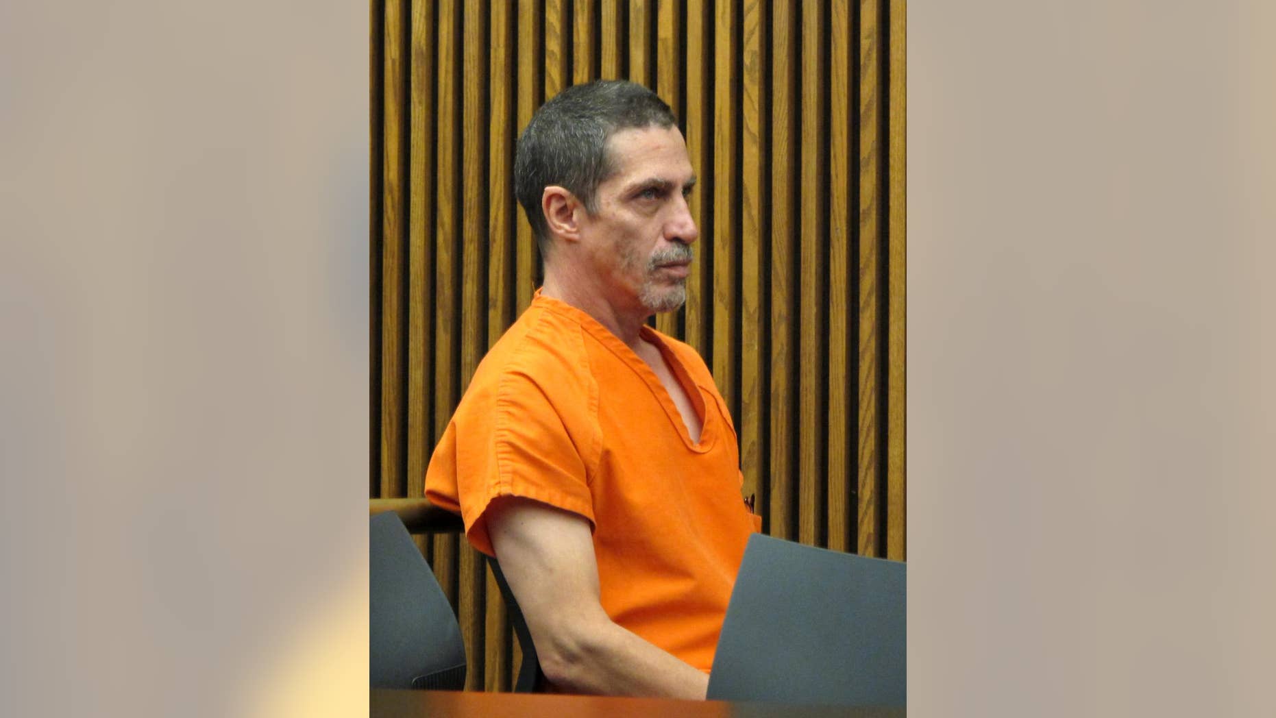 FILE - In this Tuesday, Dec. 1, 2015 file photo, Bobby Hernandez, right, listens to defense attorney Ralph DeFranco in Cuyahoga County Common Pleas Court before pleading not guilty to kidnapping and other charges in Cleveland. Hernandez is scheduled to be sentenced on multiple charges Wednesday, April 13, 2016, in Cleveland. Hernandez, 53, of Cleveland, plead not guilty to charges that included kidnapping, interference of custody, tampering with records and forgery. (AP Photo/Kantele Franko, File)