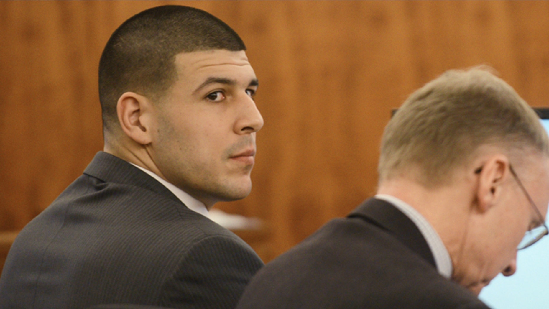 Aaron Hernandez, left, sits with his attorney Charles Rankin during his trial at Bristol Superior Court on Wednesday, Feb. 11, 2015 in Fall River, Mass. (AP Photo/The Boston Herald, Ted Fitzgerald, Pool)