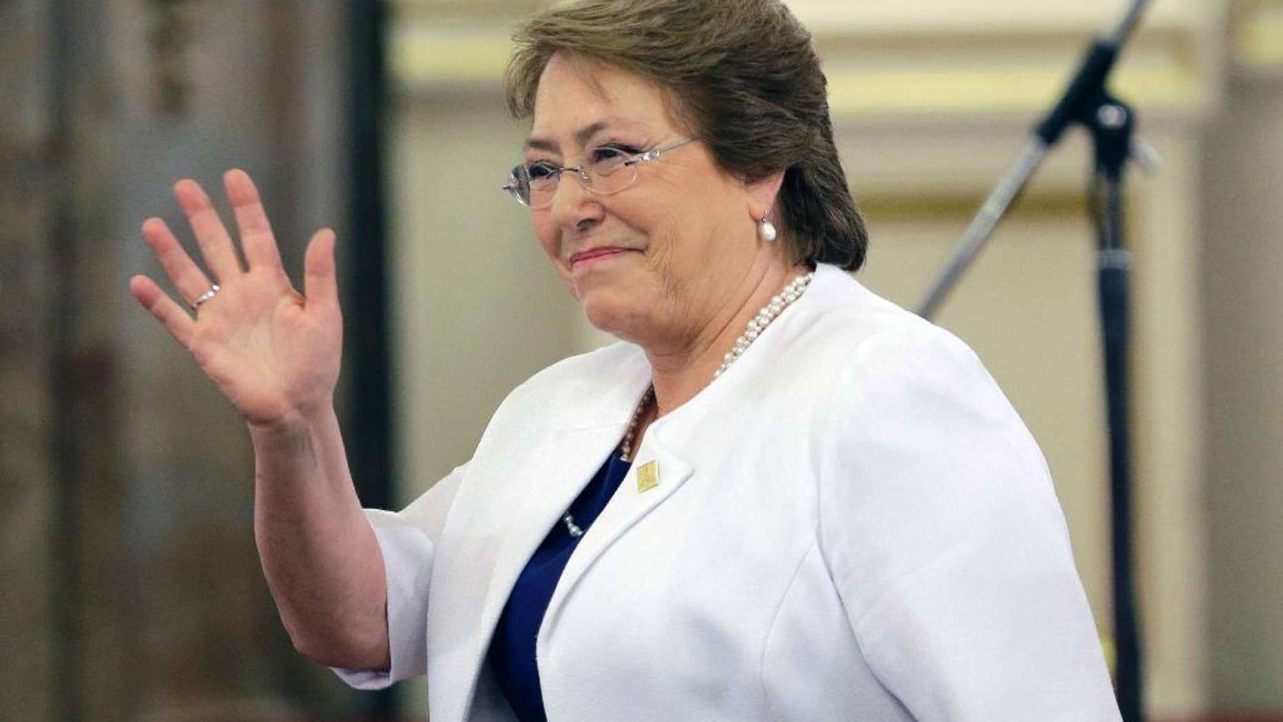 Chile's President Michelle Bachelet waves as she arrives for the inauguration ceremony of Argentina's new President Mauricio Macri at the government house, in Buenos Aires, Argentina, Thursday, Dec. 10, 2015. Macri, the former mayor of Buenos Aires who hails from one of Argentina's richest families, took the oath of office in Congress in front of legislators, several Latin American heads of state and other dignitaries. (AP Photo/Victor R. Caivano)