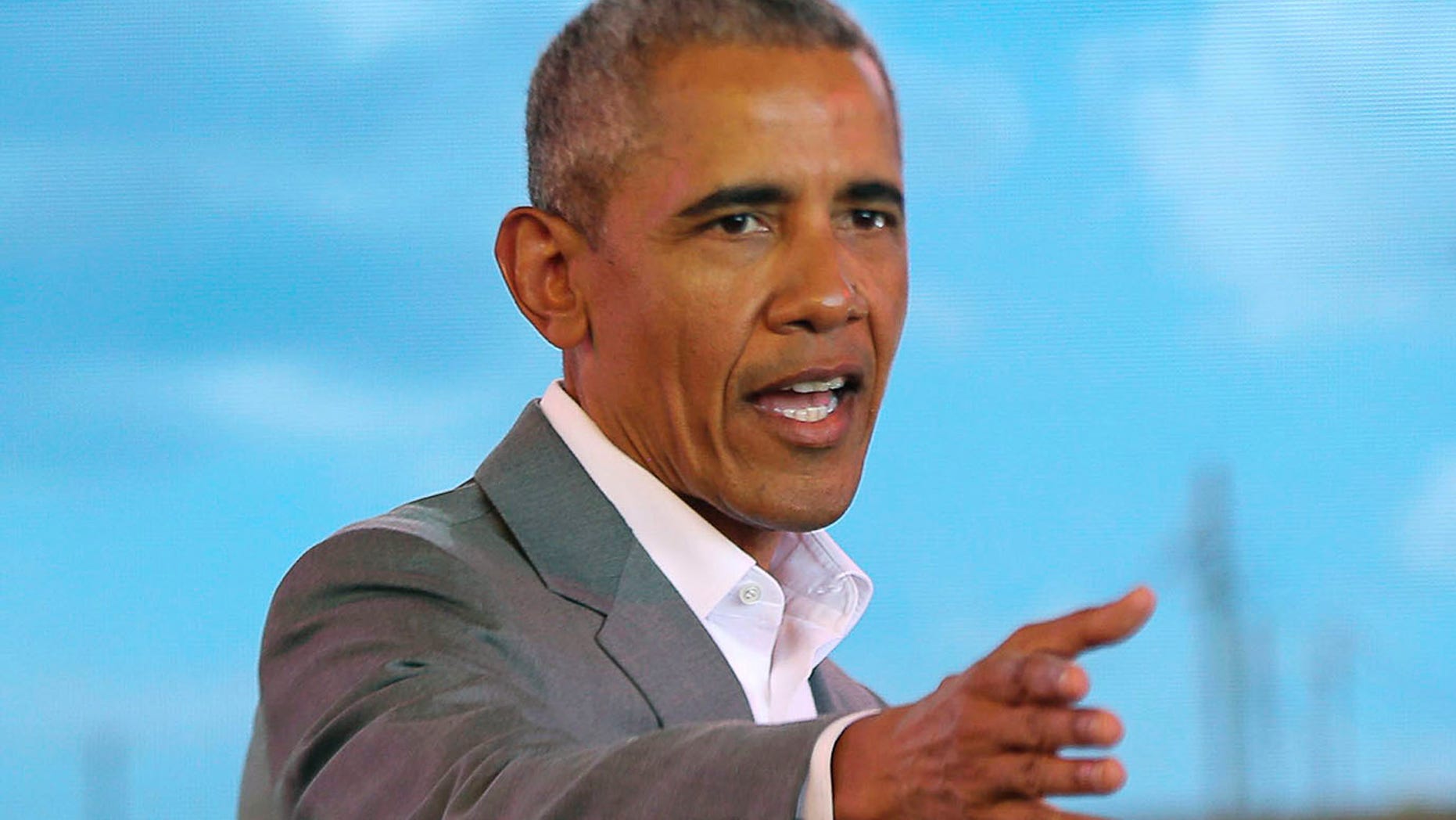 Former US President Barack Obama gestures to the crowd, during an event in Kogelo, Kisumu, Kenya, Monday, July 16, 2018. Obama is in Kenya to launch a sports and training center founded by his half-sister, Auma Obama. (