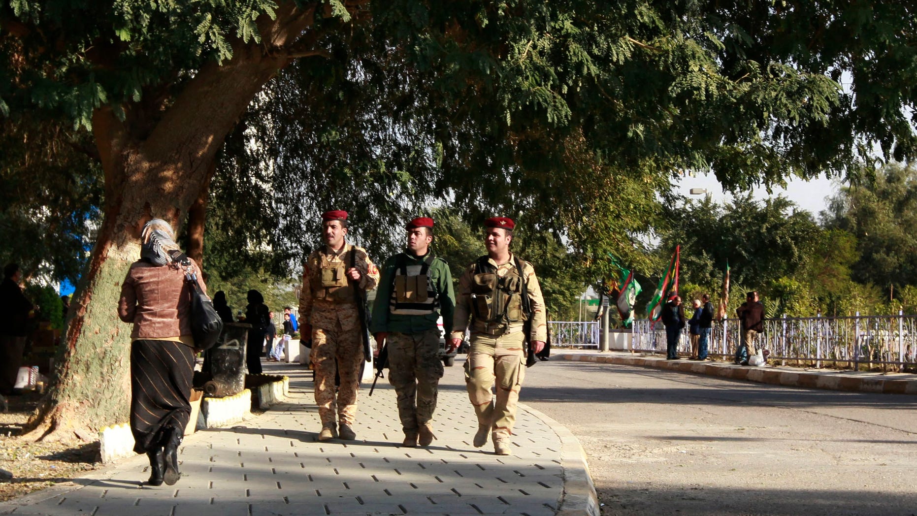 Dec. 18, 2012: Iraqi Presidential guards walk outside the hospital where Iraqi president Jalal Talabani is receiving treatment at the Medical City in Baghdad, Iraq.