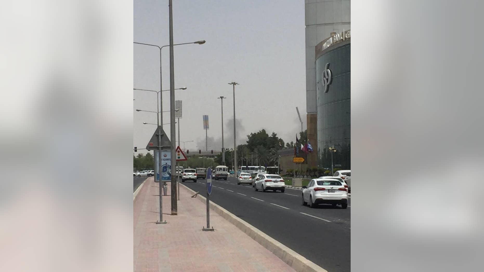 This picture posted on social media shows thick black smoke billowing from the Tawar Mall complex, Wednesday, July 20, 2016. Authorities say a fire has broken out at a shopping mall under construction in the country’s capital, the second such blaze in the 2020 World Cup host nation in less than four months. The Ministry of Interior said firefighters had contained the fire near the Dahl al-Hamam park. No casualties were reported. (Haris Aghadi Twitter via AP)