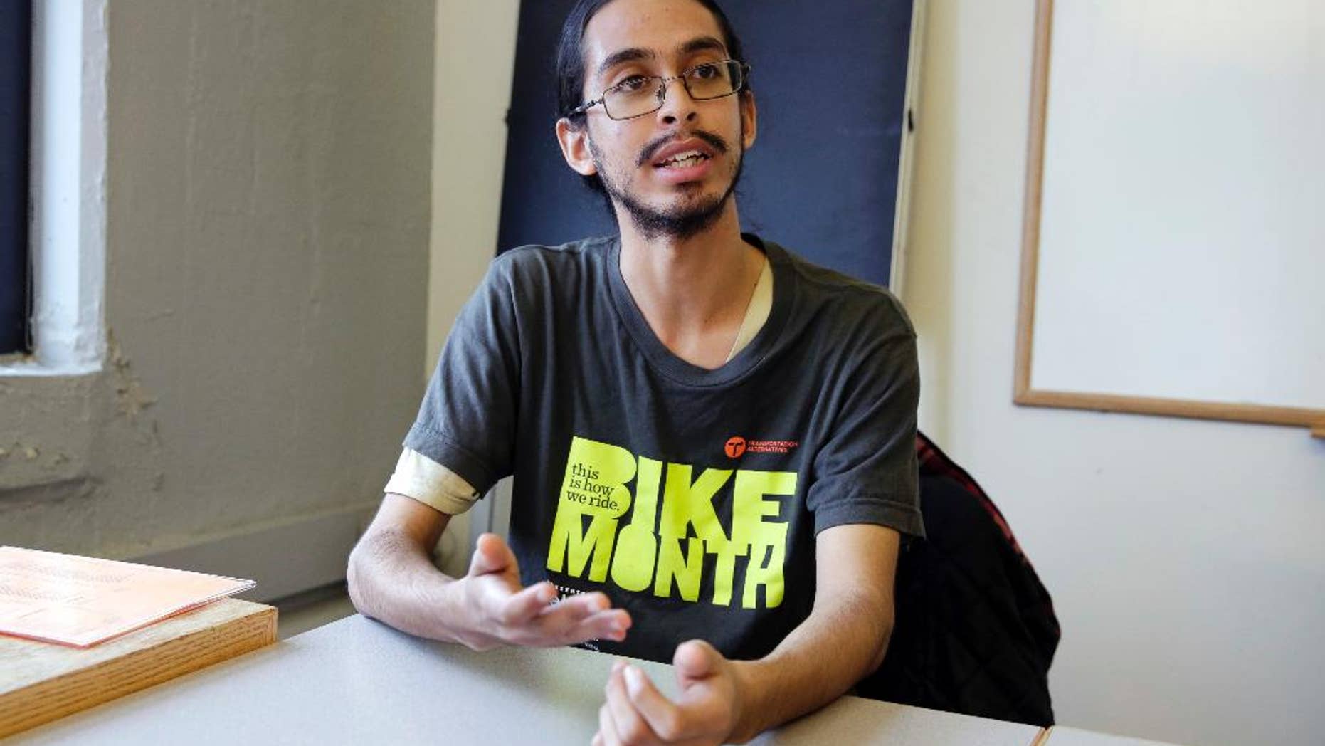 Samuel Santaella, 23, from the Queens borough of New York, speaks during an interview the offices of Riders Alliance, in New York, Wednesday, Nov. 30, 2016. The Riders Alliance, a commuter advocacy group, along with the anti-poverty group Community Service Society of New York, has been calling on Democratic Mayor Bill de Blasio to include an estimated $200 million in the city’s preliminary budget plan this January that would help pay for discounted subway and bus rides. (AP Photo/Richard Drew)