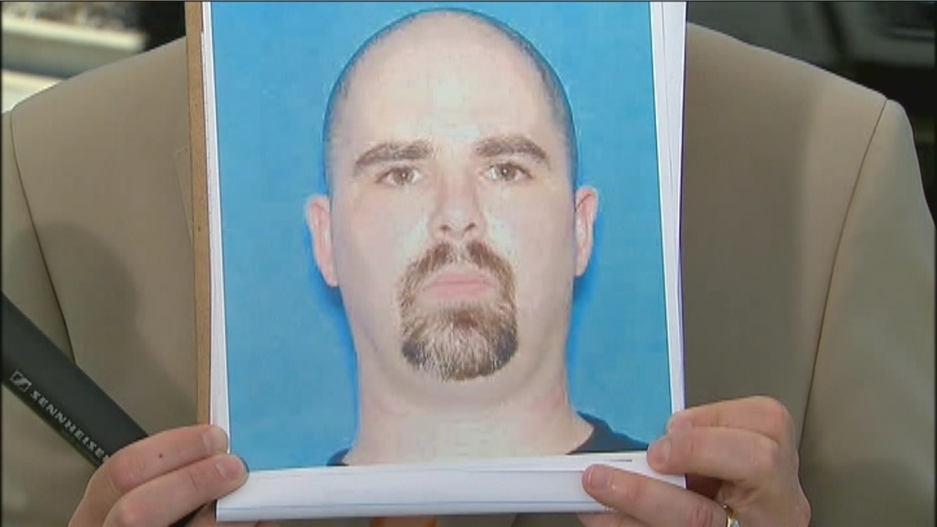 This photo released by authorities shows 40-year-old shooting suspect Wade Michael Page.