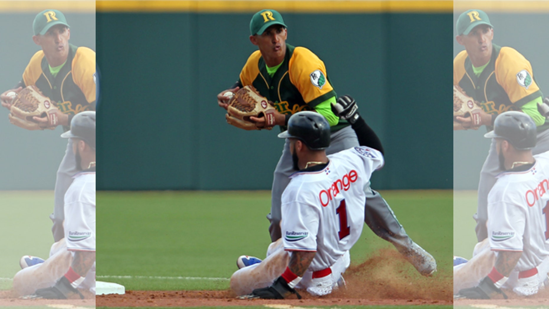 Cuba's Dainer Moreira, facing the camera, during a game in San Juan, Puerto Rico, Tuesday, Feb. 3, 2015.