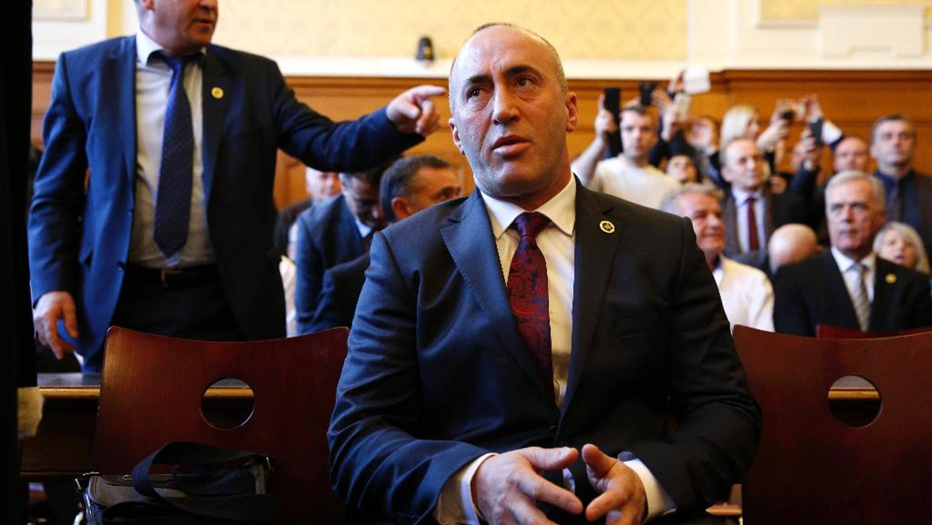 FILE - In this Thursday, March 2, 2017 file photo, Ramush Haradinaj, a former Kosovo prime minister, appears in court in Colmar. Albania’s president has granted citizenship to the former prime minister of Kosovo. Nishani on Monday, April 24, 2017 issued a decree granting Albanian citizenship to Haradinaj and his wife Anita. (AP Photo/Jean-Francois Badias, File)