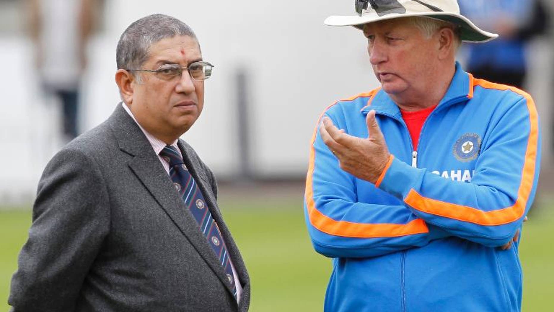 Narayanaswami Srinivasan (L), Secretary of the Board of Control for Cricket in India (BCCI), talks with India's coach Duncan Fletcher during a training session at Lord's Cricket Ground in London, on July 20, 2011.