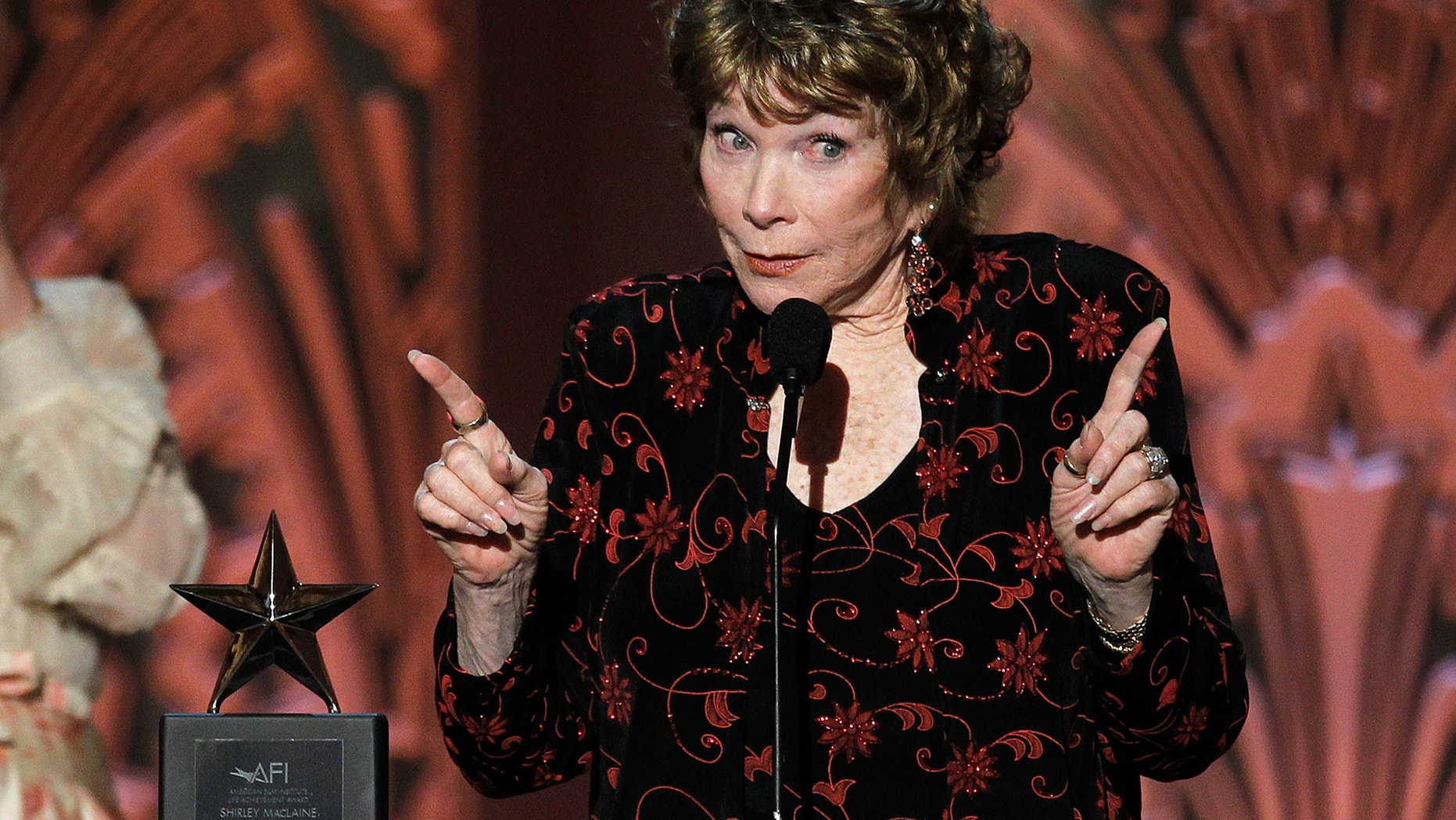 Actress Shirley MacLaine gestures as she speaks at the TV Land cable channel taping of the AFI Life Achievement Award, honoring MacLaine, in Los Angeles June 7, 2012.