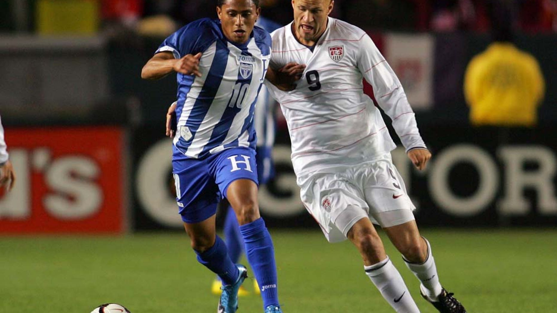 CARSON, CA - JANUARY 23: Ramon Nunez #10 of Honduras holds off a challenge by Conor Casey #9 of USA during their international friendly match on January 23, 2010 in Carson, California. Honduras defeated USA 3-1. (Photo by Victor Decolongon/Getty Images)