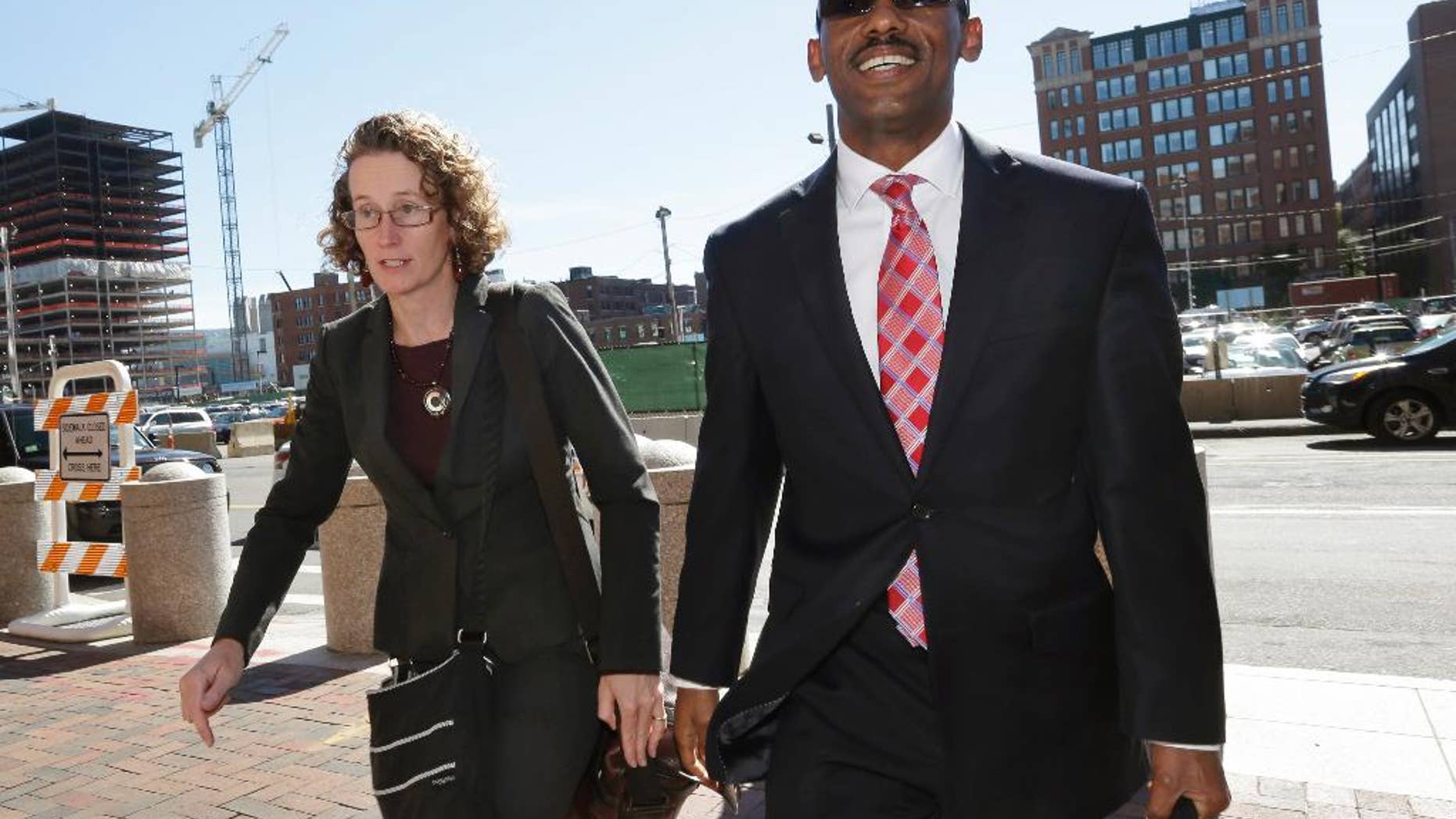 Attorneys for Robel Phillipos, Susan Church, left, and Derege Demissie, arrive at federal court Tuesday, Sept. 23, 2014, in Boston. Phillipos, 21, of Cambridge, Mass., a college friend of Boston Marathon bombing suspect Dzhokhar Tsarnaev, is charged with lying to authorities investigating the bombing. A judge on Tuesday denied a motion to move next week's trial for Phillipos. Jury selection is set to begin Monday in U.S. District Court. Opening statements are scheduled for Oct. 6. (AP Photo/Steven Senne)