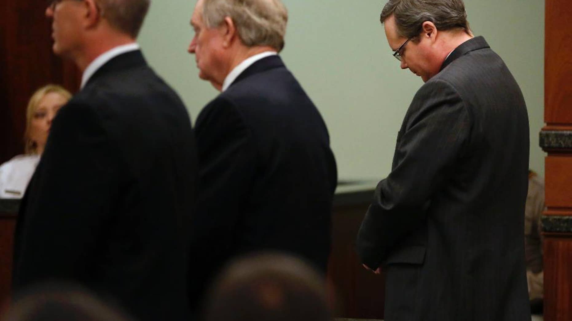 Eric Williams lowers his head as a guilty verdict is read during his capital murder trial at the Rockwall County Courthouse in Rockwall, Texas, on Thursday, Dec. 4, 2014. The jury convicted Williams, a former public official, in the 2013 murder of Cynthia McLelland and her husband Kaufman County District Attorney Mike McLelland. Williams now faces a potential death sentence. (AP Photo/The Dallas Morning News, Pool)