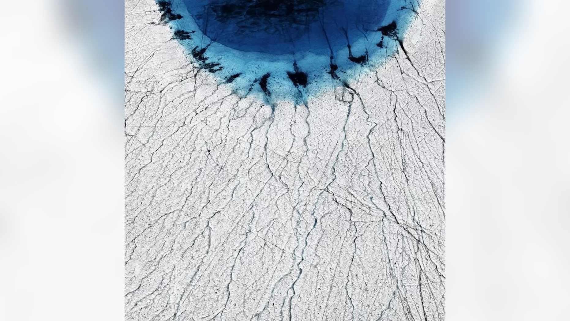 Greenland's lakes are draining away in hours, thanks to a vast network of fissures hidden on the ice sheet below. (Credit: Timo Lieber)