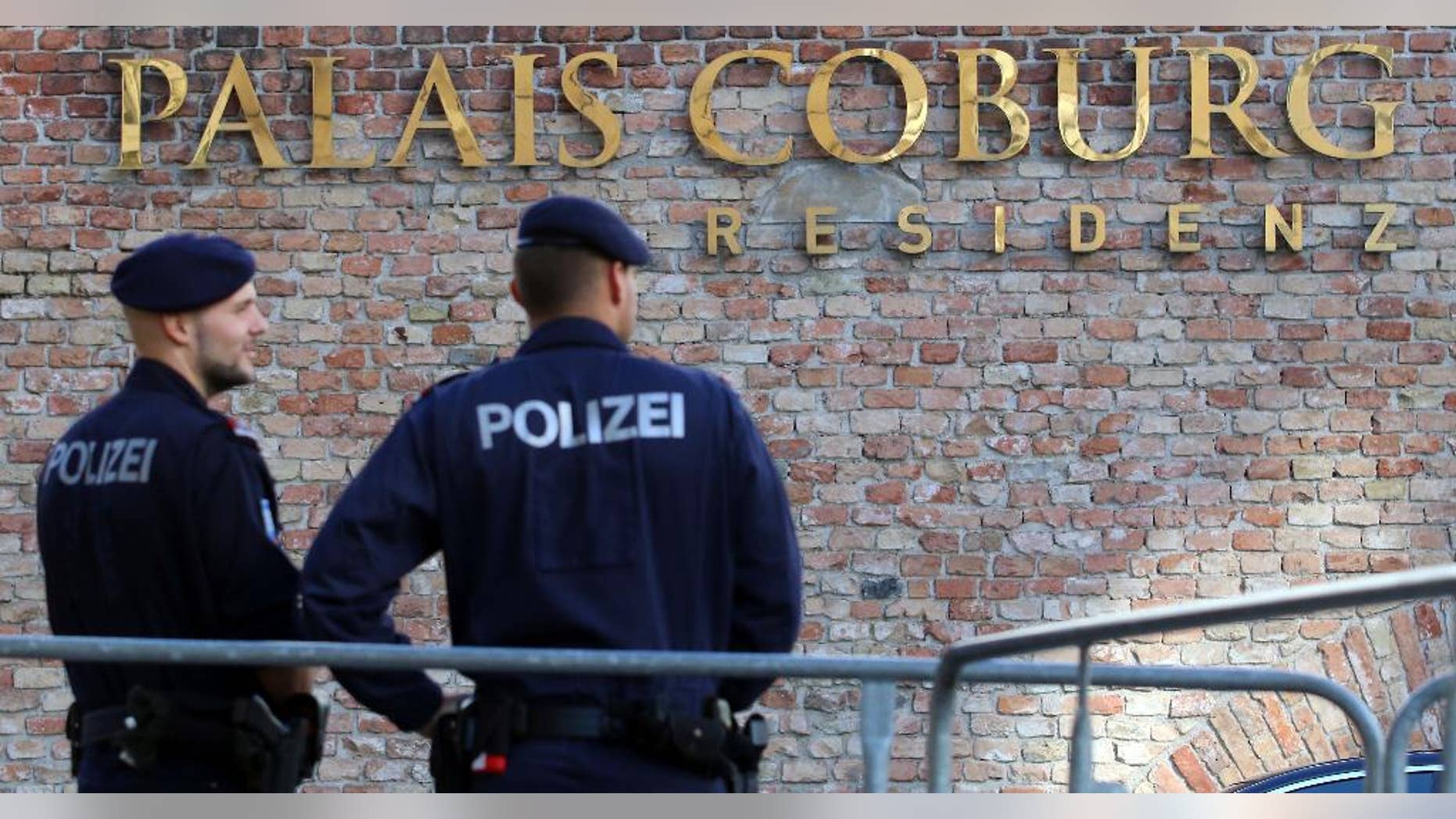 Police guard in front of Hotel Palais Coburg during closed-door nuclear talks in Vienna, Austria, Thursday, Oct. 16, 2014. EU foreign policy chief Catherine Ashton and Iranian Foreign Minister Mohammad Javad Zarif continue their nuclear talks in an effort to meet the target date of Nov. 24., but with less than six weeks left, there may be no alternative than to prolonging them. (AP Photo/Ronald Zak)