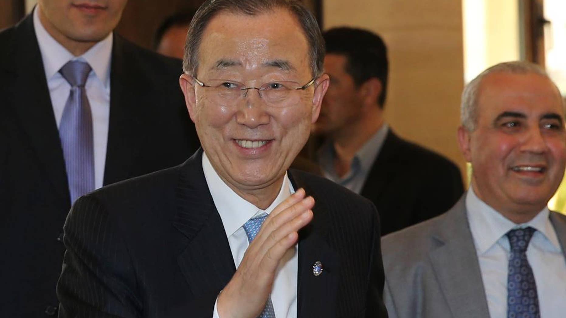 United Nations Secretary-General Ban Ki-moon waves to journalists on his arrival to meet with Lebanese parliament speaker Nabih Berri, in Beirut, Lebanon, Thursday, March 24, 2016. The U.N. chief arrived in Lebanon on an official visit that comes as the U.N.-brokered peace talks in Geneva between the Syrian government and the opposition are to adjourn until later in April. Ban will meet top Lebanese officials and address refugee support, youth unemployment, and private sector development. (AP Photo/Hussein Malla)