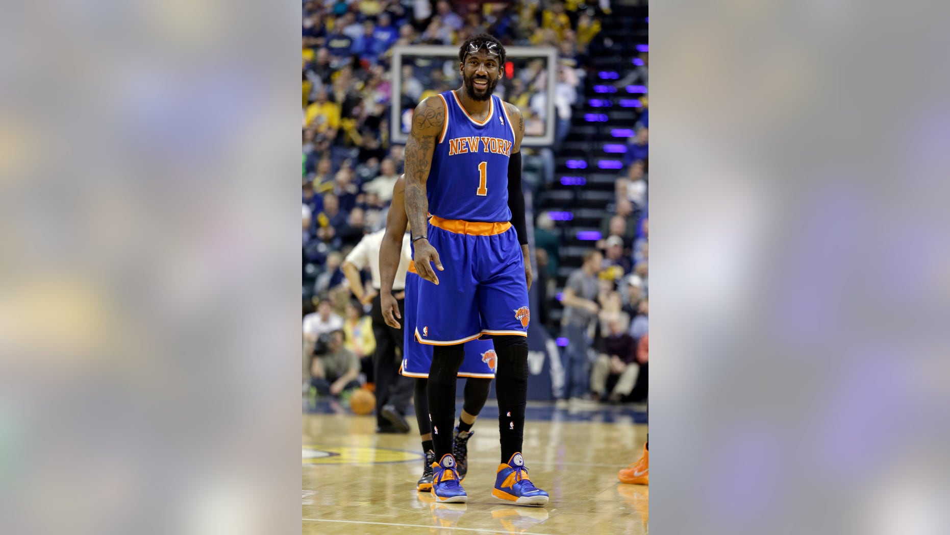 New York Knicks forward Amare Stoudemire walks off the court after being shaken up on a foul by the Indiana Pacers during the second half of an NBA basketball game in Indianapolis, Thursday, Jan. 16, 2014. The Pacers defeated the Knicks 117-89. (AP Photo/Michael Conroy)
