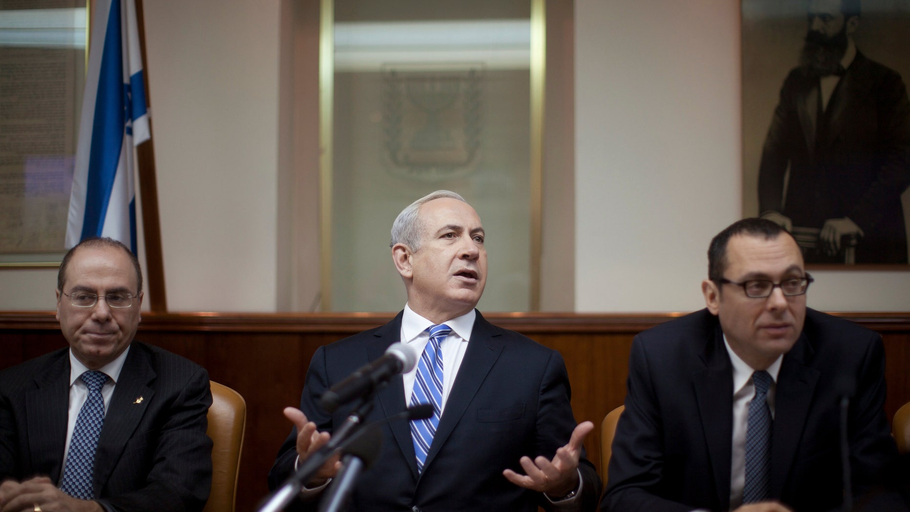 Israeli Prime Minister Benjamin Netanyahu heads the weekly cabinet meeting in his office in Jerusalem, Sunday, Feb. 10, 2013. Netanyahu said Sunday the upcoming visit of U.S. President Barack Obama will focus on Iran’s nuclear program, the violence in Syria and the stalled peace process with the Palestinians. (AP Photo/Uriel Sinai, Pool)