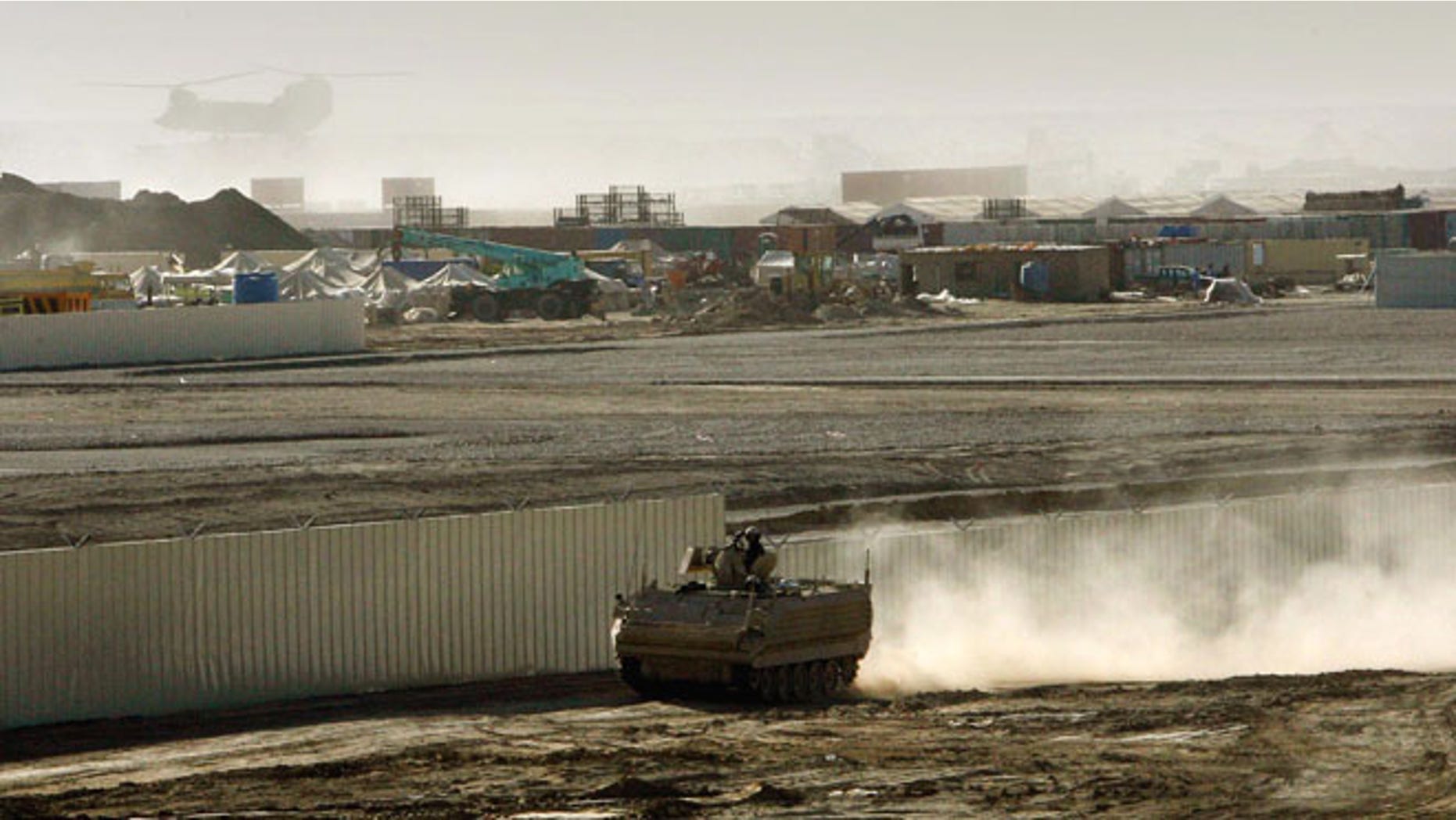 An armored vehicle patrols on the periphery of Camp Bastion in southern Afghanistan, in this Wednesday, Jan. 10, 2007 file photo.