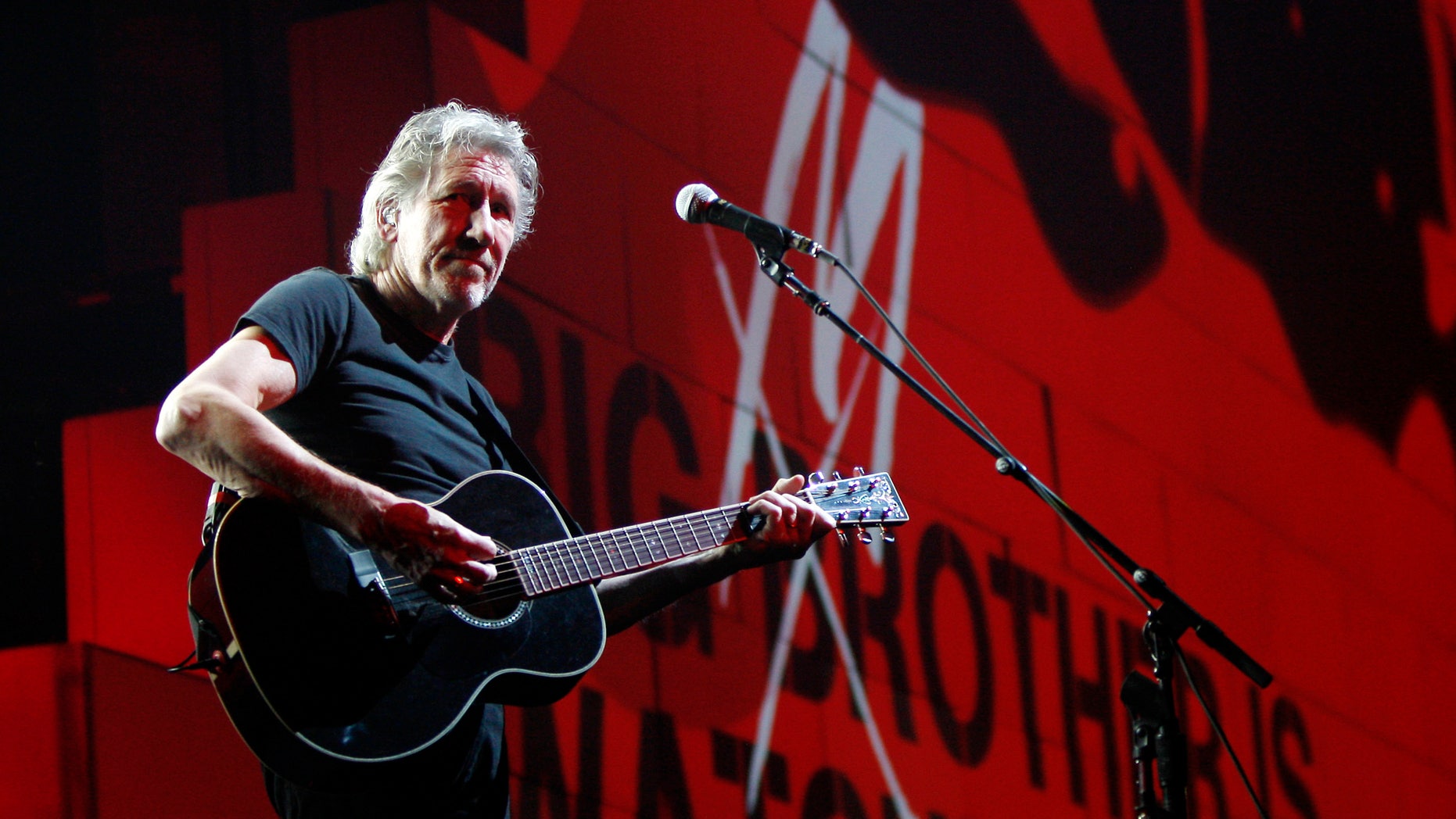 FILE - In this April 1, 2011 file photo, Roger Waters performs during his "The Wall Tour 2010/2011" in Milan, Italy. Now that his three-year world tour for “The Wall” has finally come to an end, Waters wants to set the record straight over criticism he’s received from Jewish groups regarding his use of the Star of David symbol in the show and his support for a cultural boycott of Israel. (AP Photo/Antonio Calanni, File)