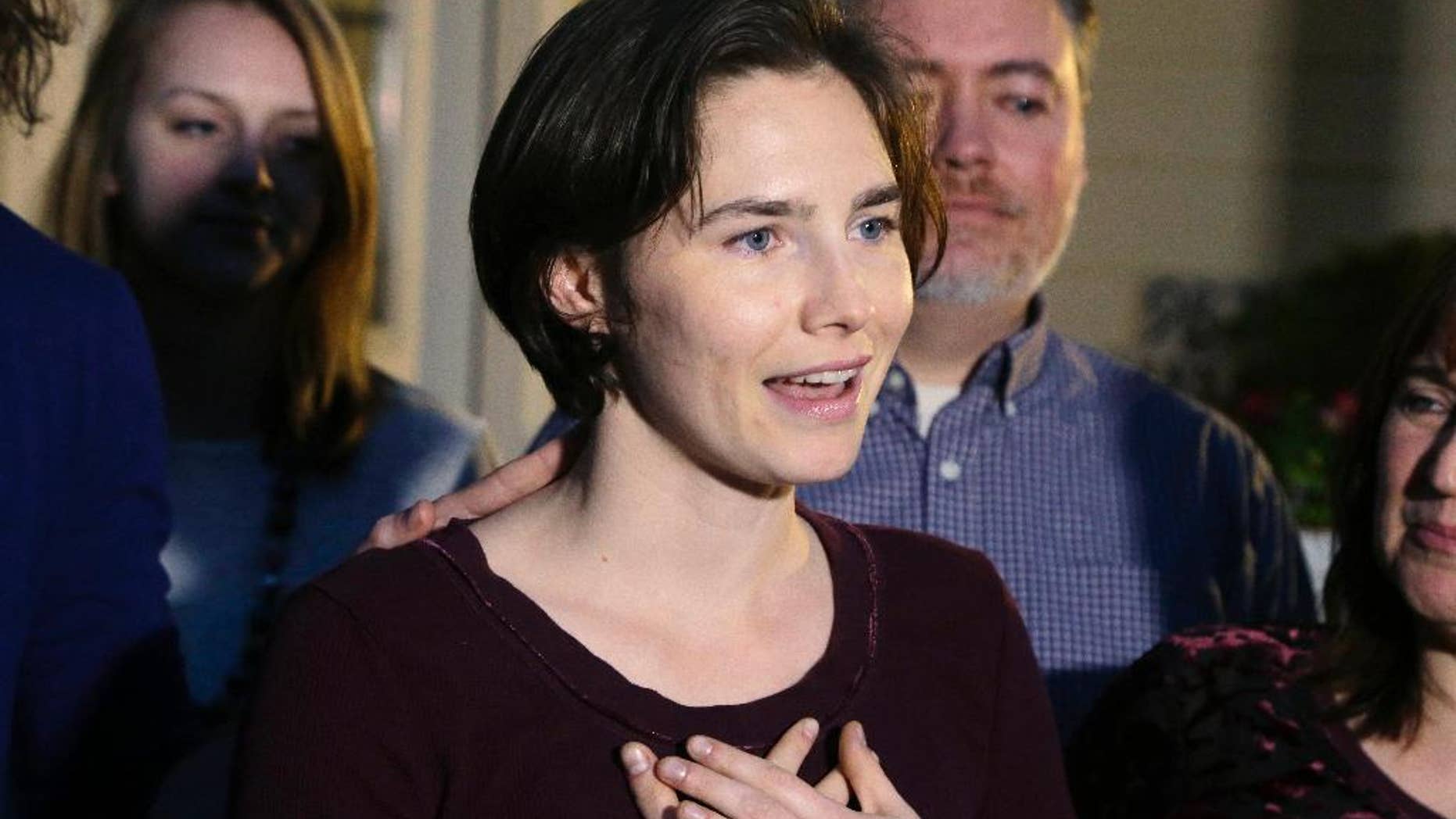 FILE - In this Friday, March 27, 2015 file photo, Amanda Knox talks to members of the media outside her mother's home in Seattle. The European Court of Human Rights has agreed to hear Amanda Knox's case challenging her slander conviction during the trial for her British roommate's 2007 murder, her Italian defense lawyer said Friday, May 20, 2016. Dalla Vedova said the Strasbourg court's decision this week is "good news" for his client, because the vast majority of cases are rejected at the preliminary stage. The Italian government has until September to provide its response. (AP Photo/Ted S. Warren, file)