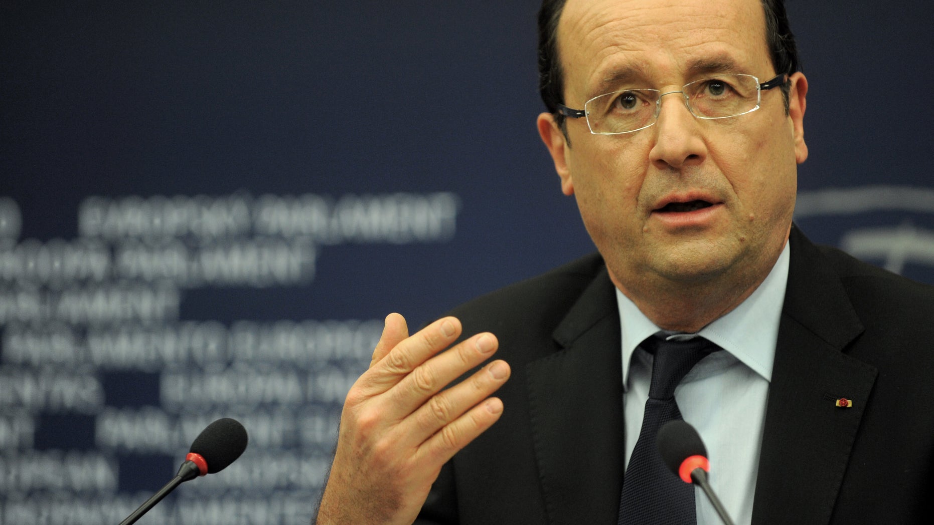 French president Francois Hollande gestures during apress conference at the European Parliament Tuesday, Feb. 5, 2013, in Strasbourg, eastern France. Hollande warns of a tough European Union summit later this week if countries including Britain continue to demand drastic cuts to the EU budget while refusing to make concessions themselves. (AP Photo/Christian Lutz)