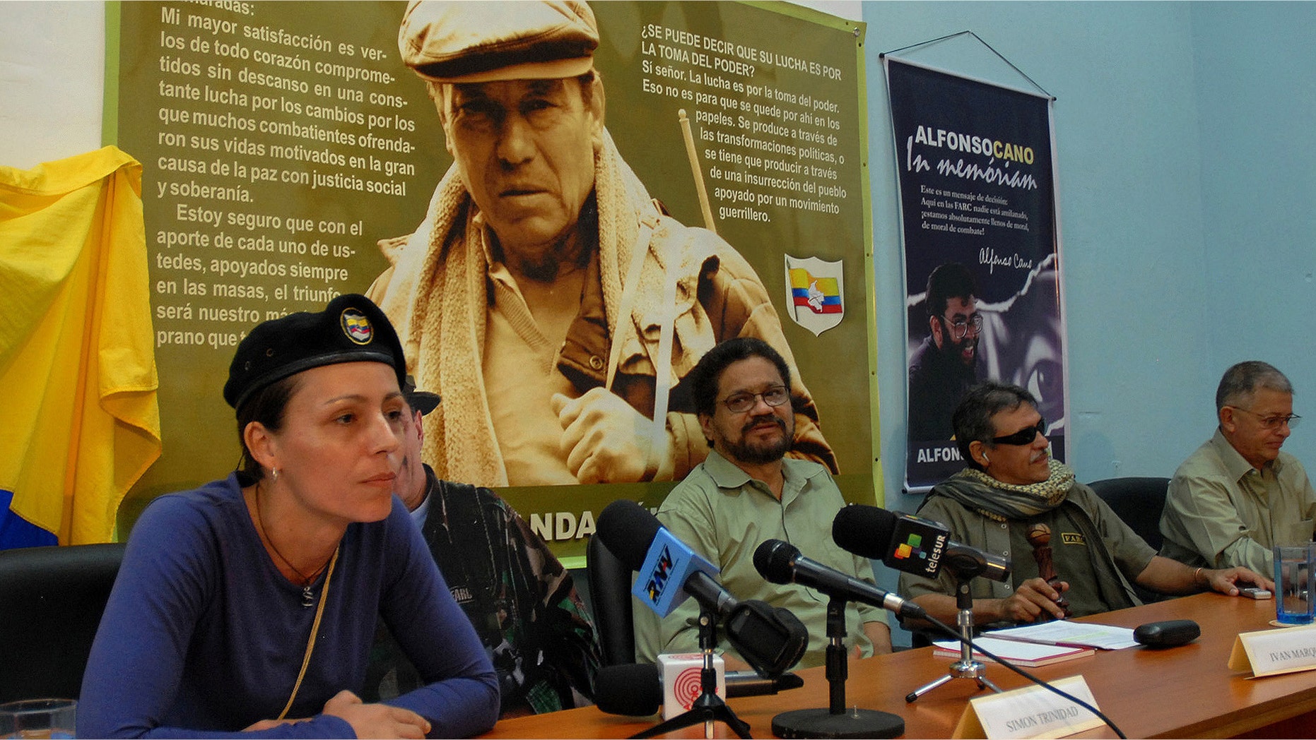 Dutch rebel Tanja Nijmeijer from FARC speaks with fellow member of the negotiating team Iván Márquez, center right, and Jesus Santrich,second from right, in Havana, Cuba.