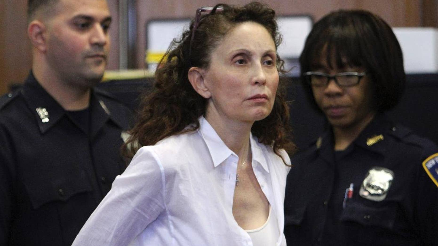 FILE - In this Aug. 11, 2011, file photo, Gigi Jordan, the multimillionaire mother charged with killing her autistic 8-year-old son, appears in Manhattan Supreme court in New York. Jordan testified at her murder trial Thursday, Oct. 9, 2014, that she heard the boy struggling to breathe and her heart pounded. She says she sobbed and tried to resuscitate her son, Jude Mirra. Jude was later found dead of a drug overdose, with Jordan on the floor. (AP Photo/File, Mary Altaffer, File)