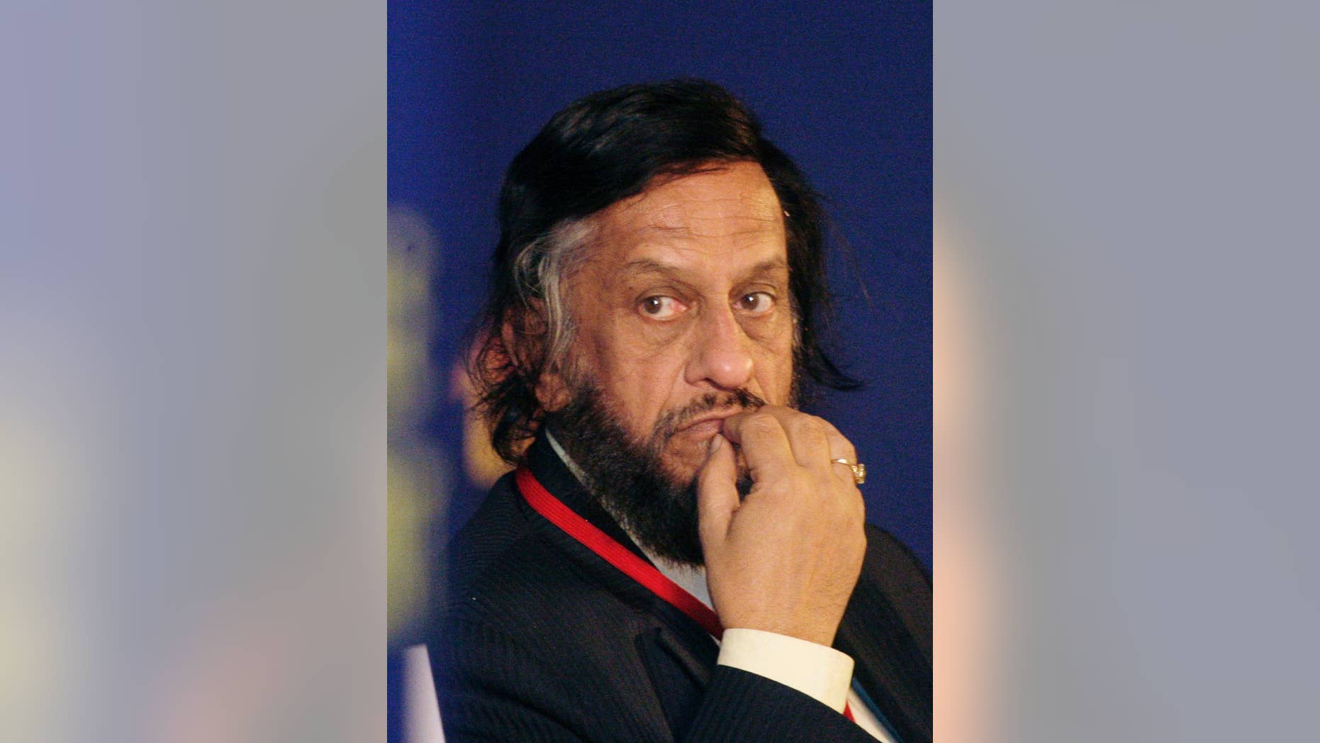 FILE- In this Feb. 6, 2010 file photo,Intergovernmental Panel on Climate Change Chairman Rajendra Pachauri listens to a speaker at the Delhi Sustainable Development Summit in New Delhi, India. A court in India's capital says there's enough evidence in a stalking and sexual harassment case for a former chairman of the U.N.'s climate body, Rajendra Pachauri, to stand trial. (AP Photo/Gurinder Osan, file)