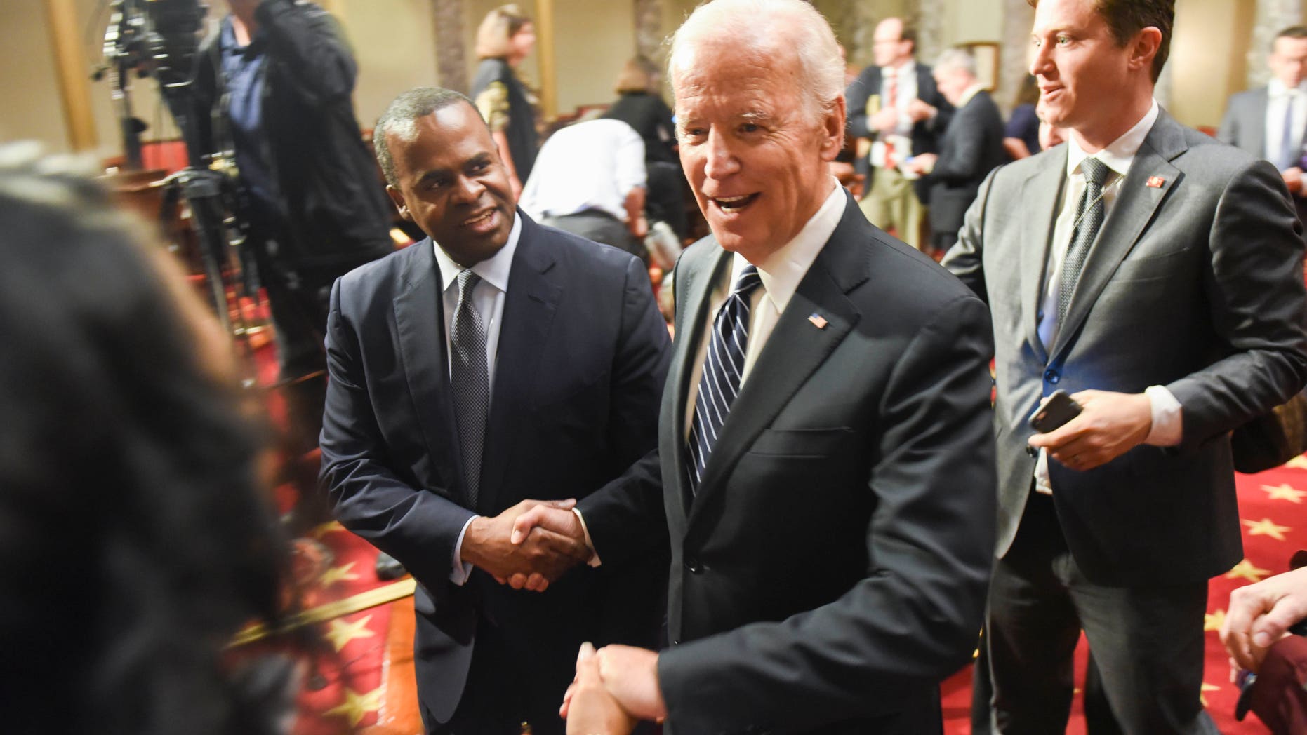Vice President Joe Biden leaves the the Old Senate Chamber following a mock swearing in ceremony on Capitol Hill in Washington, Tuesday, Jan. 3, 2017, as the 115th Congress begins. (AP Photo/Kevin Wolf)