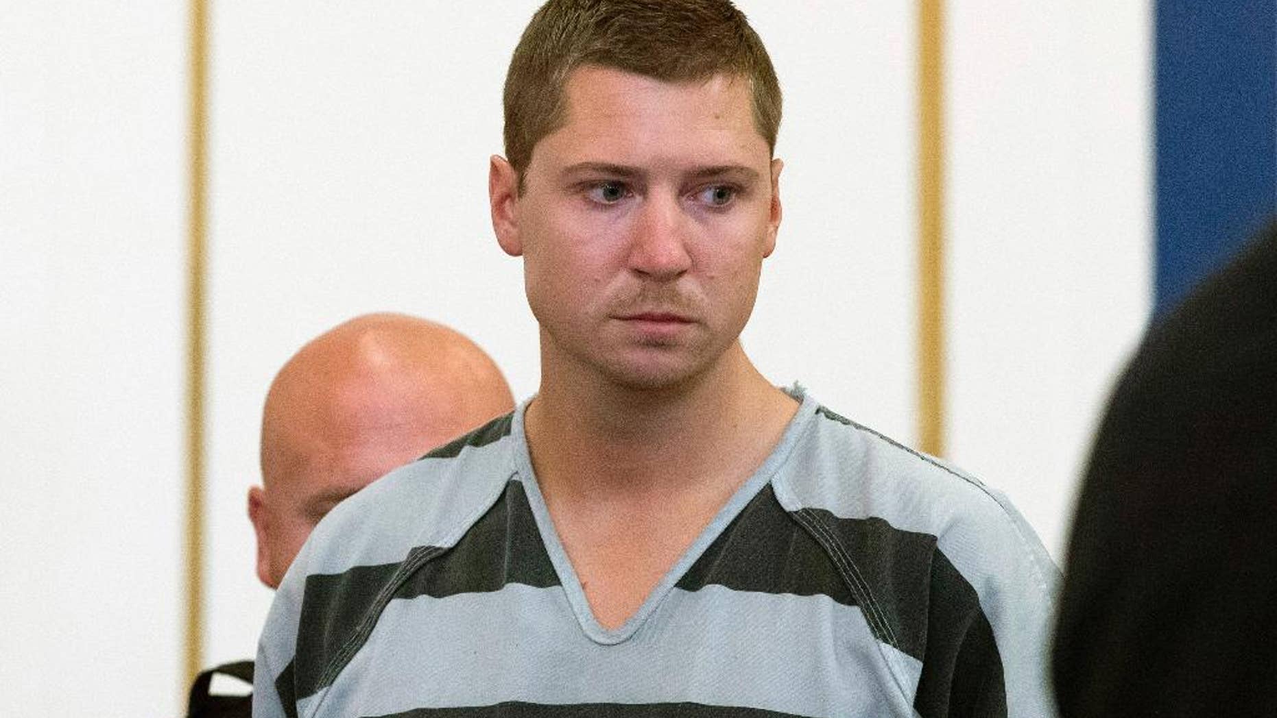 FILE - In this July 30, 2015 file photo, former University of Cincinnati police officer Ray Tensing appears at Hamilton County Courthouse for his arraignment in the in the July 19 shooting death of motorist Samuel DuBose in Cincinnati. An attorney for Tensing filed a request Wednesday, Aug. 26, 2015, asking the court to move the trial elsewhere. Tensing pleaded not guilty to charges of murder and involuntary manslaughter. His trial is scheduled for Nov. 16. (AP Photo/John Minchillo, File)